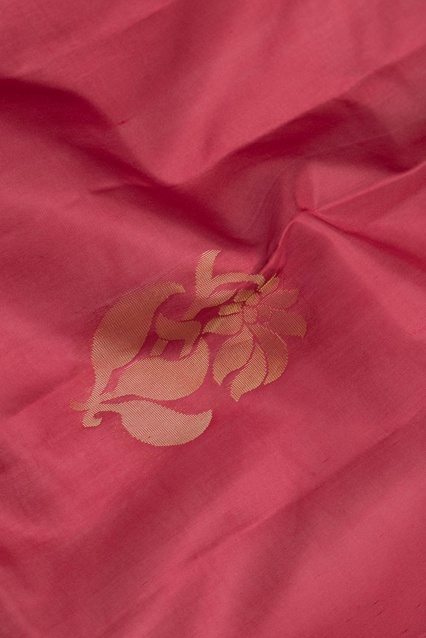 Close up of Maroon Dual Tone Soft Silk Saree with Zari Butta on the body and Zari Border.  displaying folds