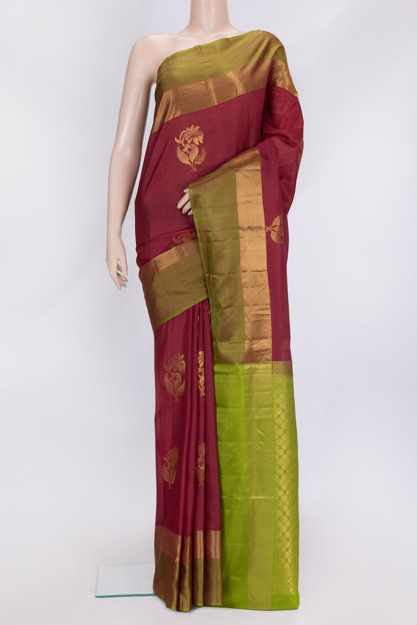 Maroon Dual Tone Soft Silk Saree with Zari Butta on the body and Zari Border.  displayed on a mannequin