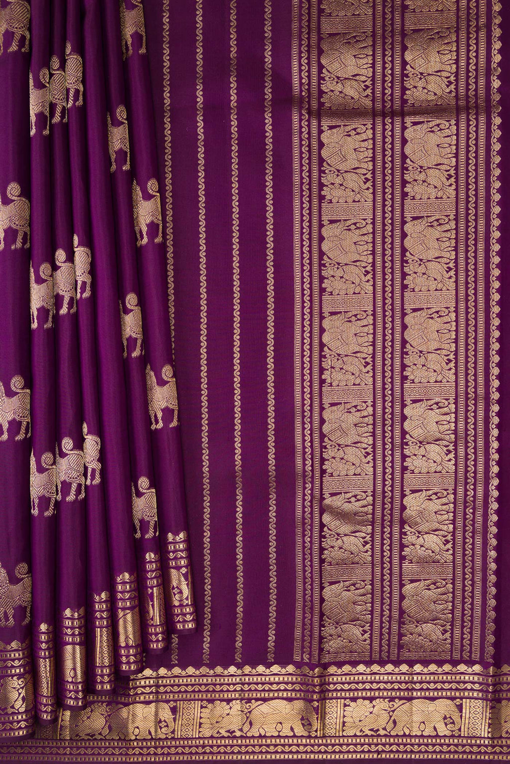 Pleats and pallu of Purple Kanjivaram Silk Saree with Zari Butta on the body and Zari Border. 