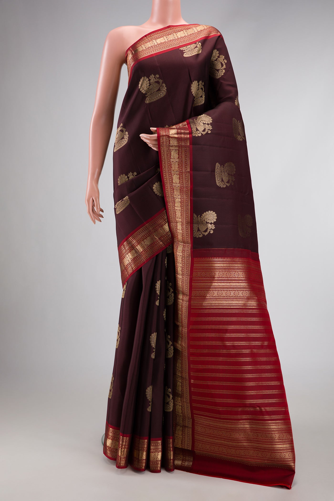 Coffee Brown Dual Tone Kanjivaram Silk Saree with Zari Butta on the body and Zari Border.  displayed on a mannequin