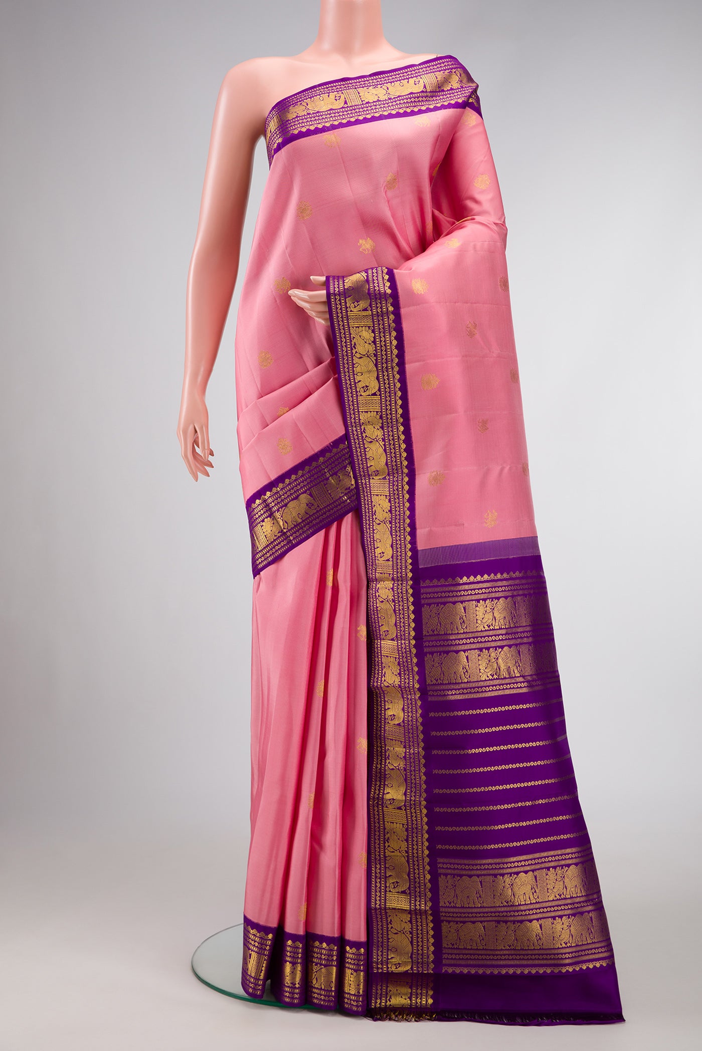 Pink Dual Tone Kanchipuram Silk Saree with Zari Butta on the body and Zari Border.  displayed on a mannequin