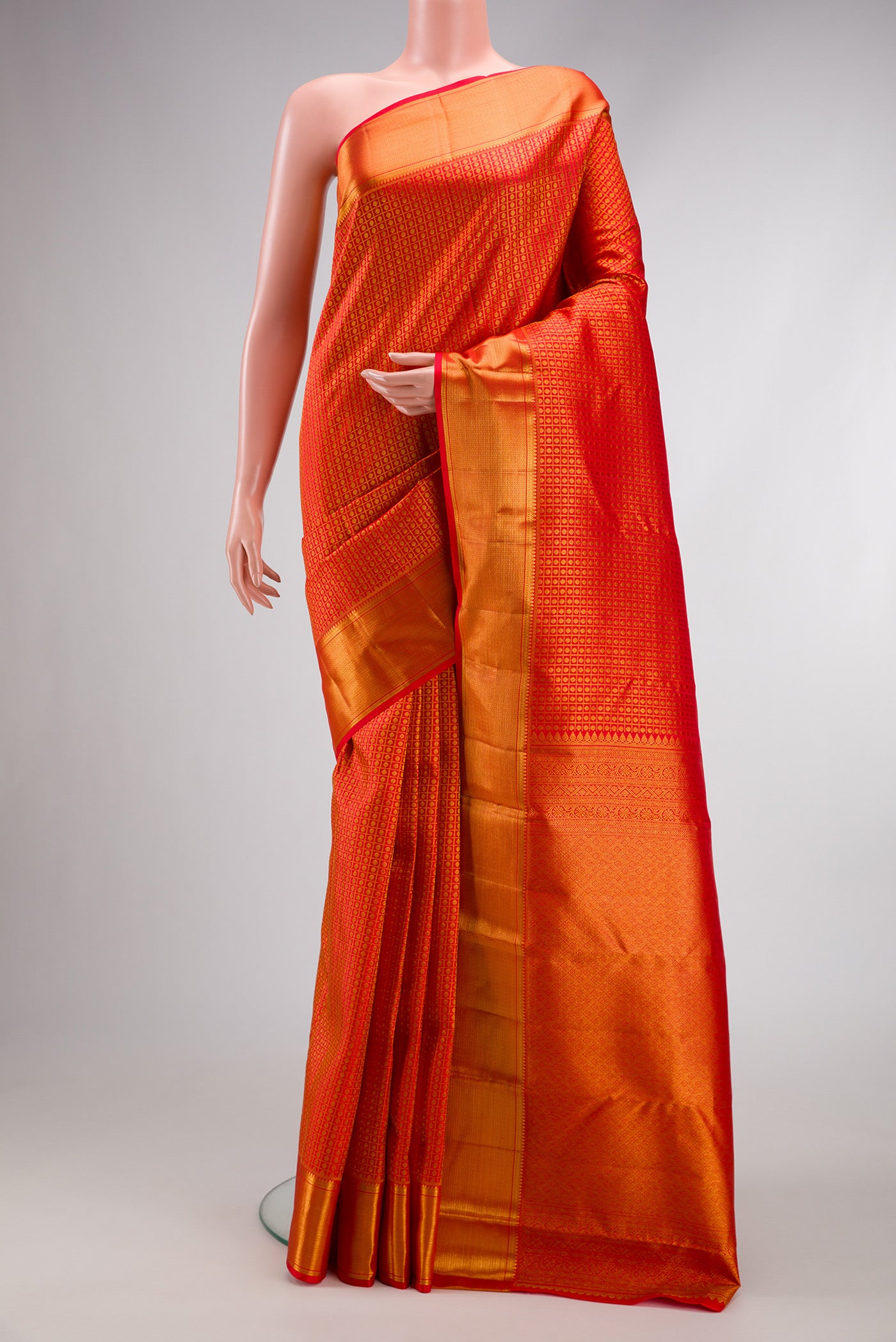 Red Dual Tone Kanchipuram Silk Saree with Zari Brocade on the body and Zari Border.  displayed on a mannequin