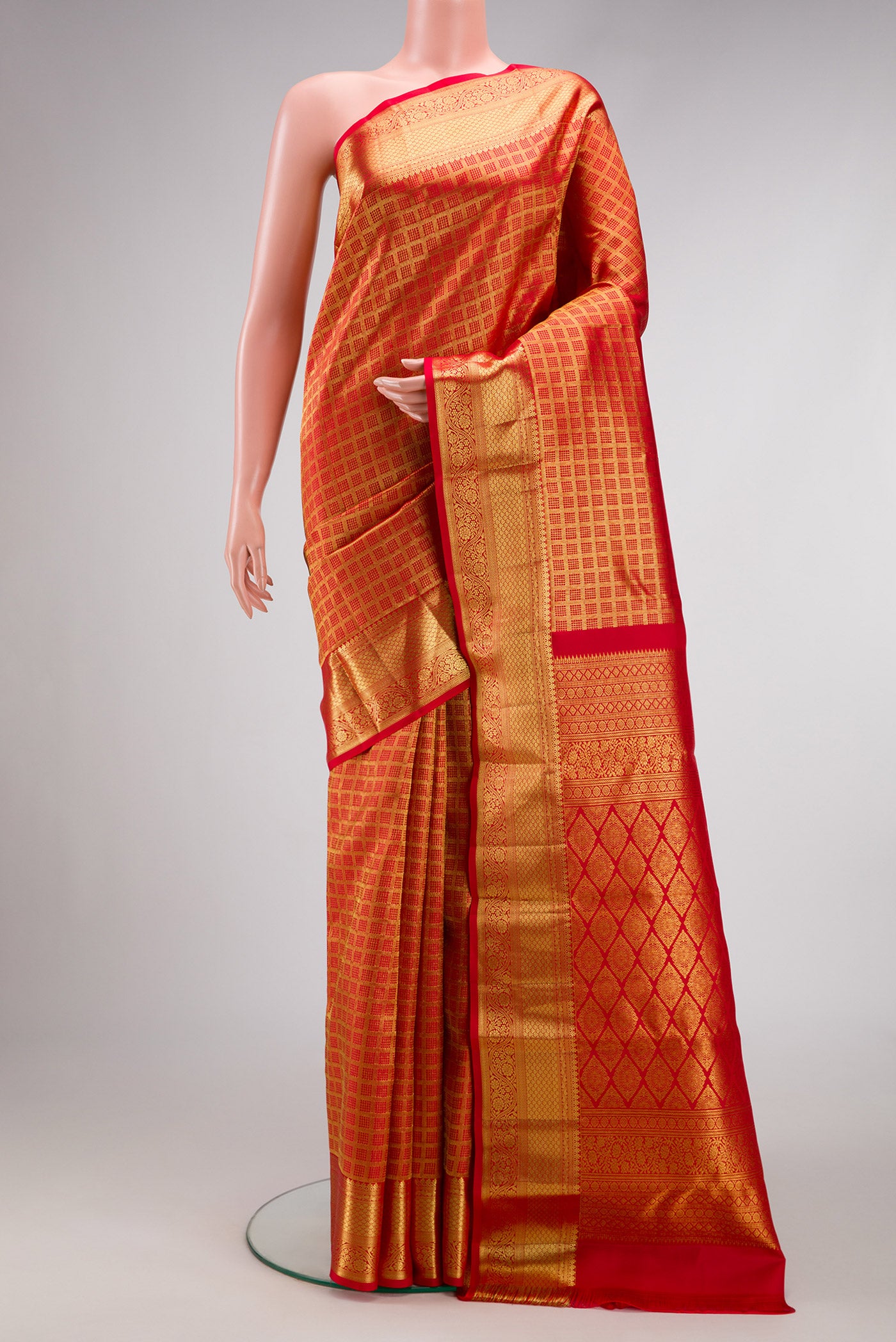 Red Dual Tone Kanchipuram Silk Saree with Zari Brocade on the body and Zari Border.  displayed on a mannequin