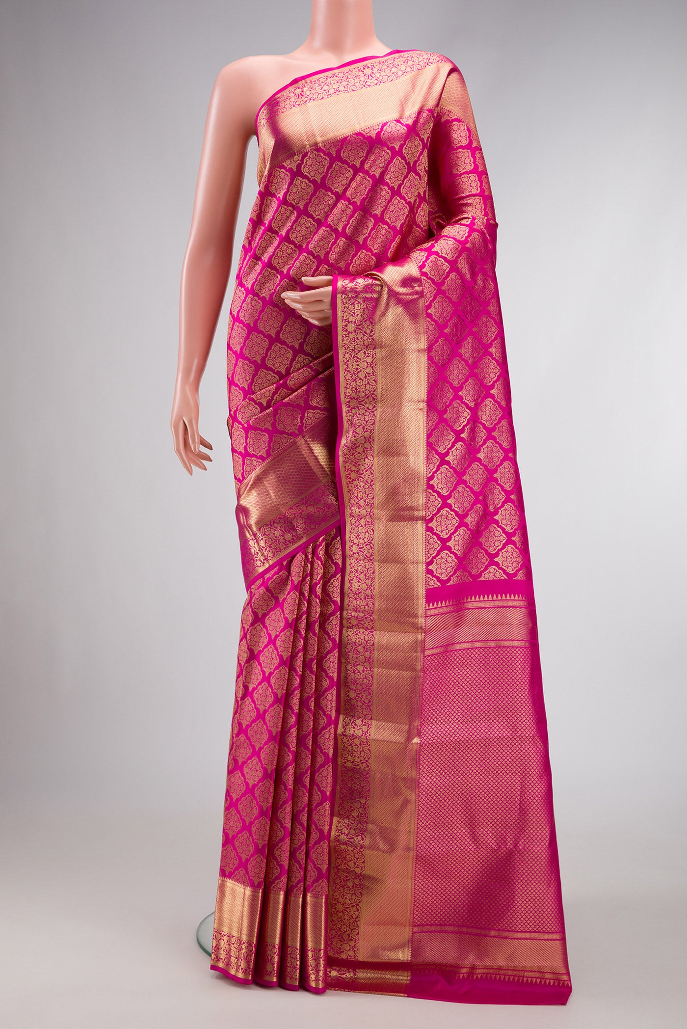 Pink Dual Tone Kanchipuram Silk Saree with Zari Brocade on the body and Zari Border.  displayed on a mannequin
