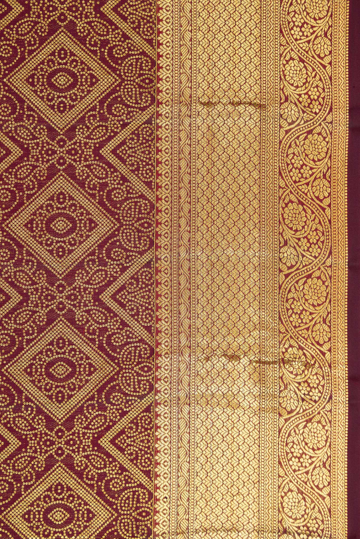 Border image of Maroon Dual Tone Kanchipuram Silk Saree with Zari Brocade on the body and Zari Border. 