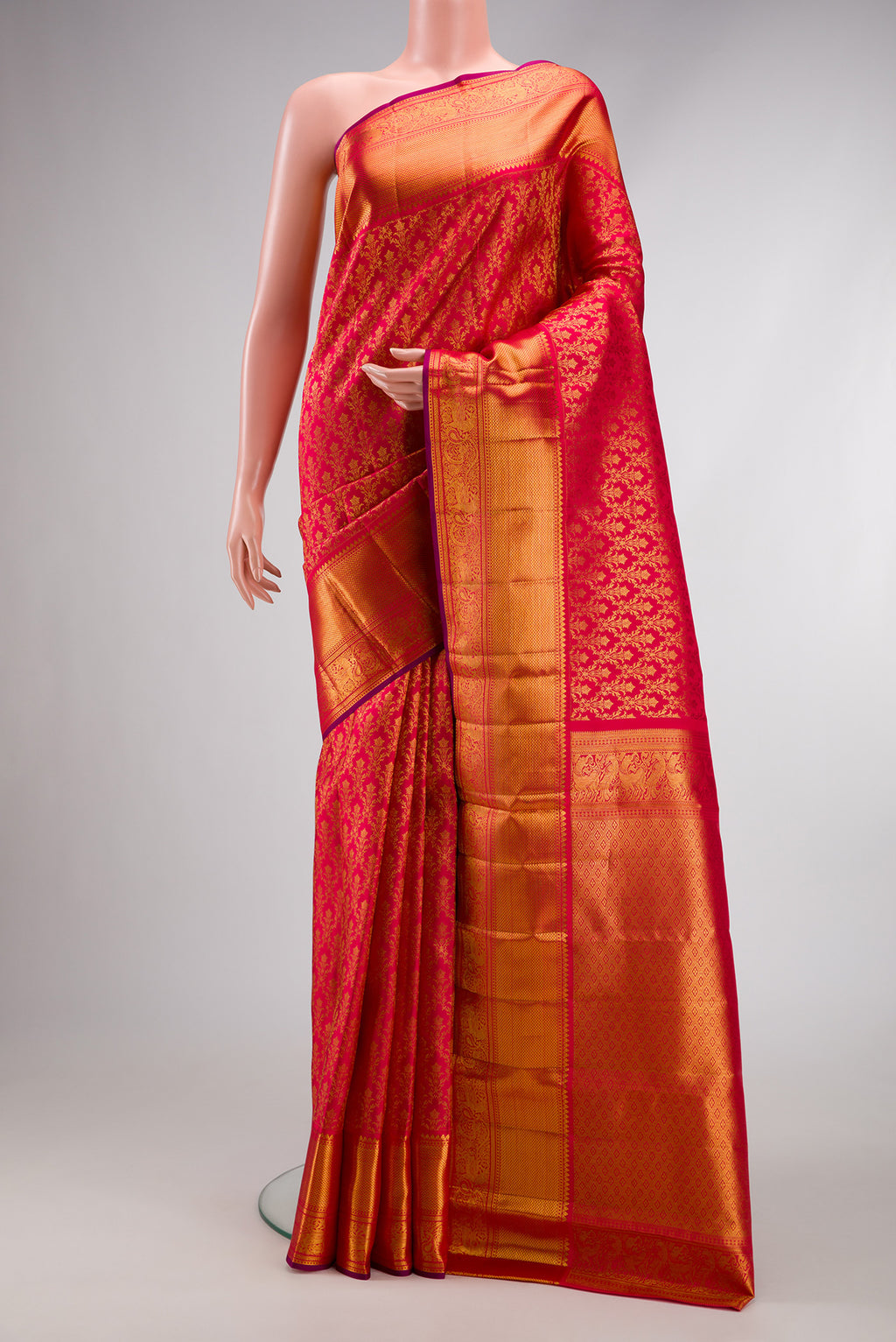 Red Dual Tone Kanchipuram Silk Saree with Zari Brocade on the body and Zari Border.  displayed on a mannequin