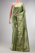 Pista Green Dual Tone Kanchipuram Silk Saree with Zari Brocade on the body and Zari Border.  displayed on a mannequin