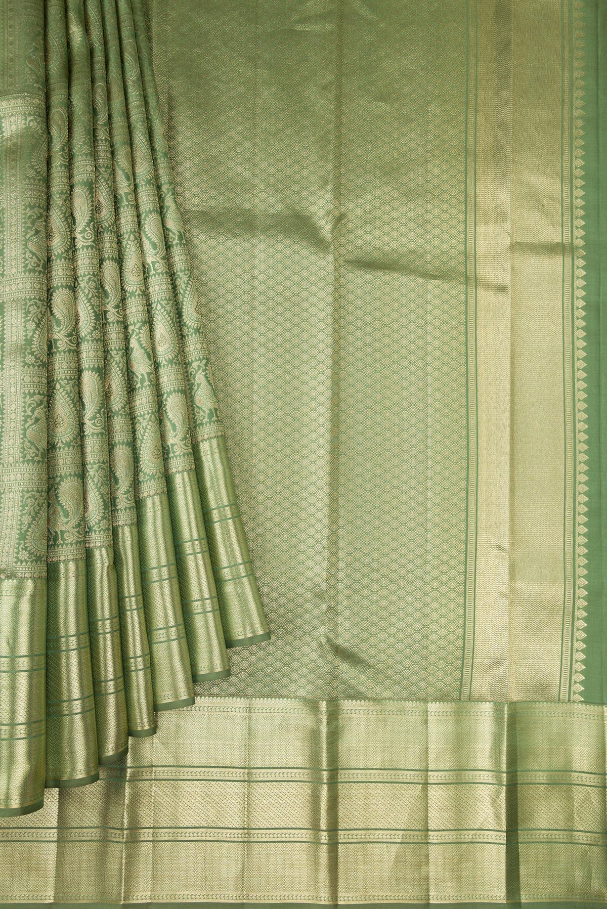 Pleats and pallu of Pista Green Dual Tone Kanchipuram Silk Saree with Zari Brocade on the body and Zari Border. 