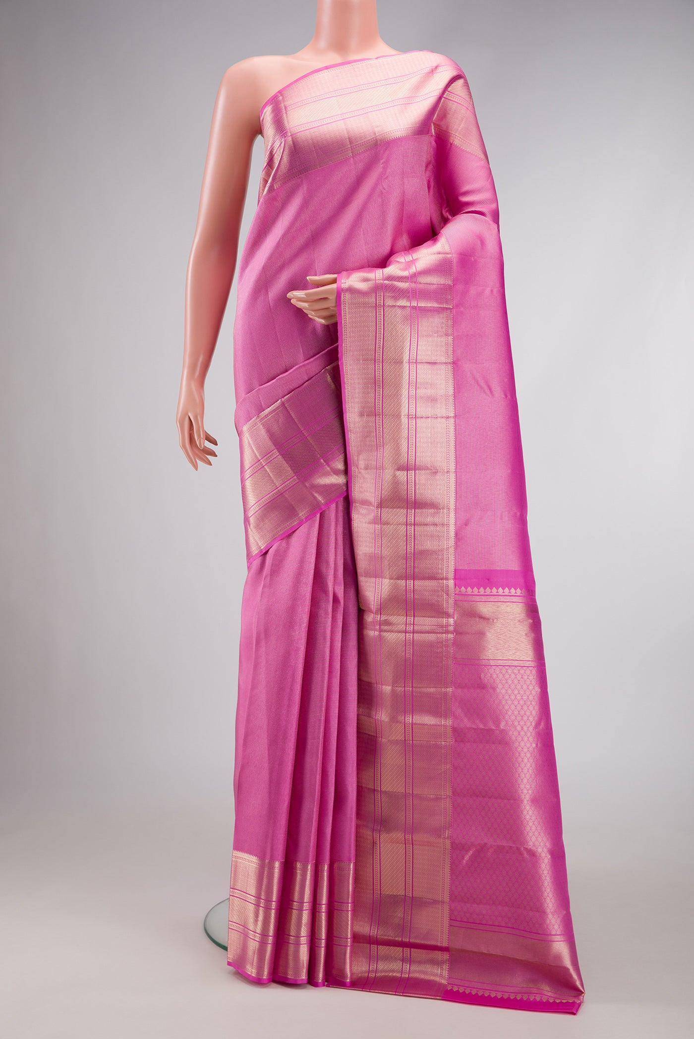 Pink Dual Tone Kanchipuram Silk Saree with Zari Brocade on the body and Zari Border.  displayed on a mannequin