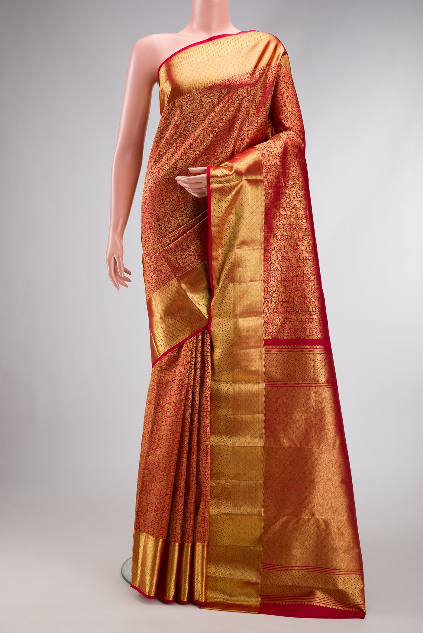 Maroon Dual Tone Kanchipuram Silk Saree with Zari Brocade on the body and Zari Border.  displayed on a mannequin