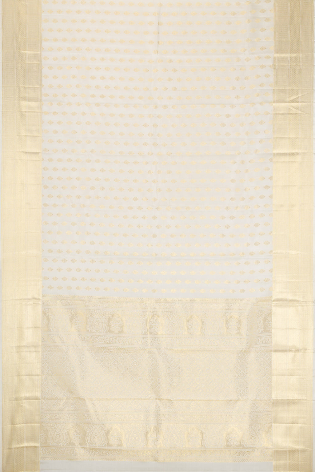 Flat view of Off White Kanchipuram Silk Saree with Zari Butta on the body and Zari Border. 