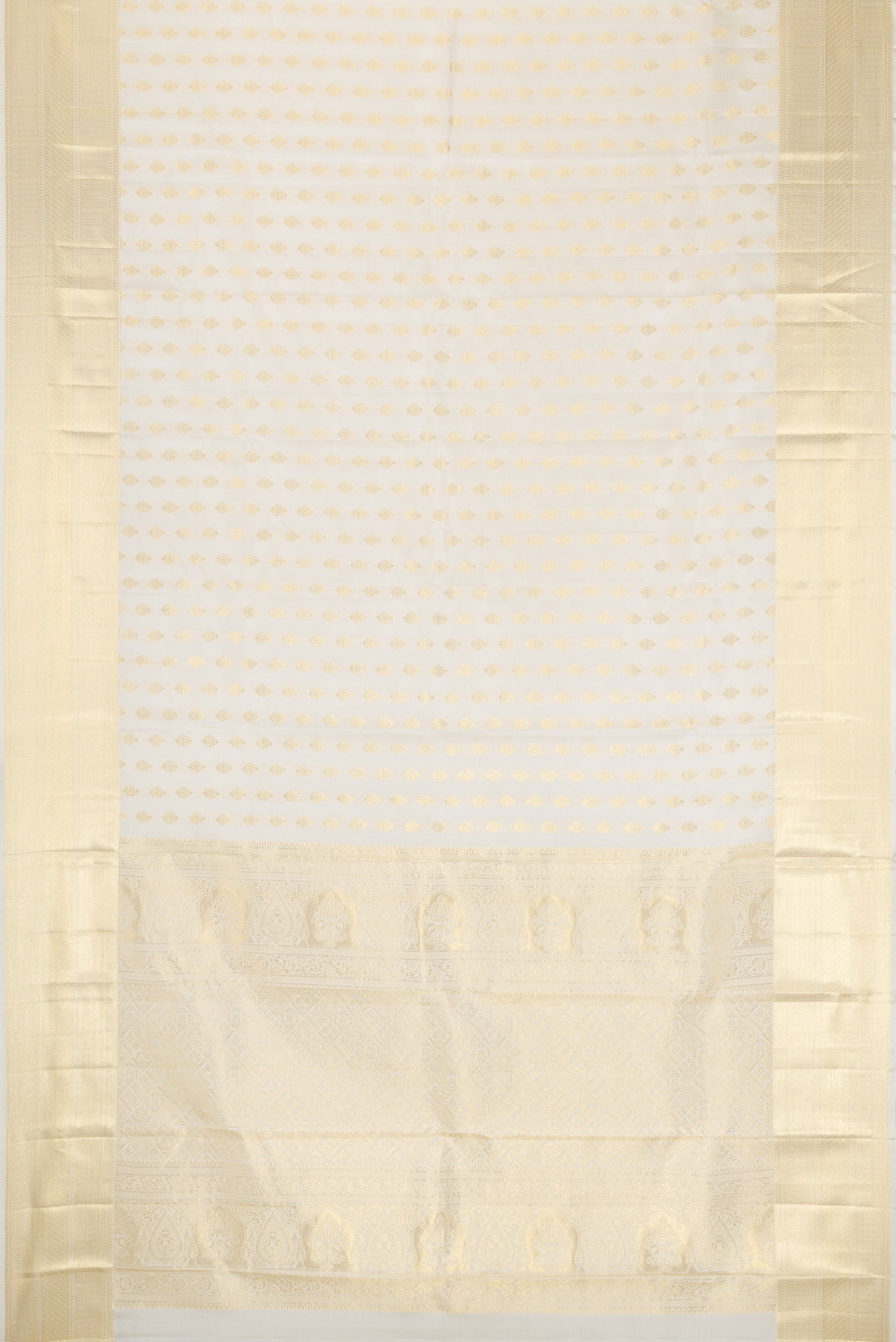 Flat view of Off White Kanchipuram Silk Saree with Zari Butta on the body and Zari Border. 
