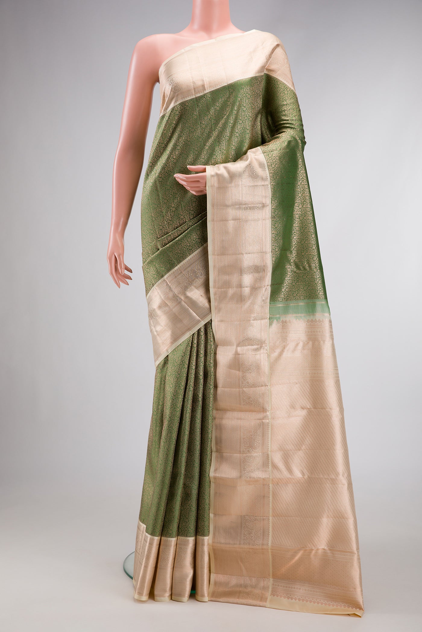 Mehandi Green Dual Tone Kanchipuram Silk Saree with Zari Brocade on the body and Zari Border.  displayed on a mannequin