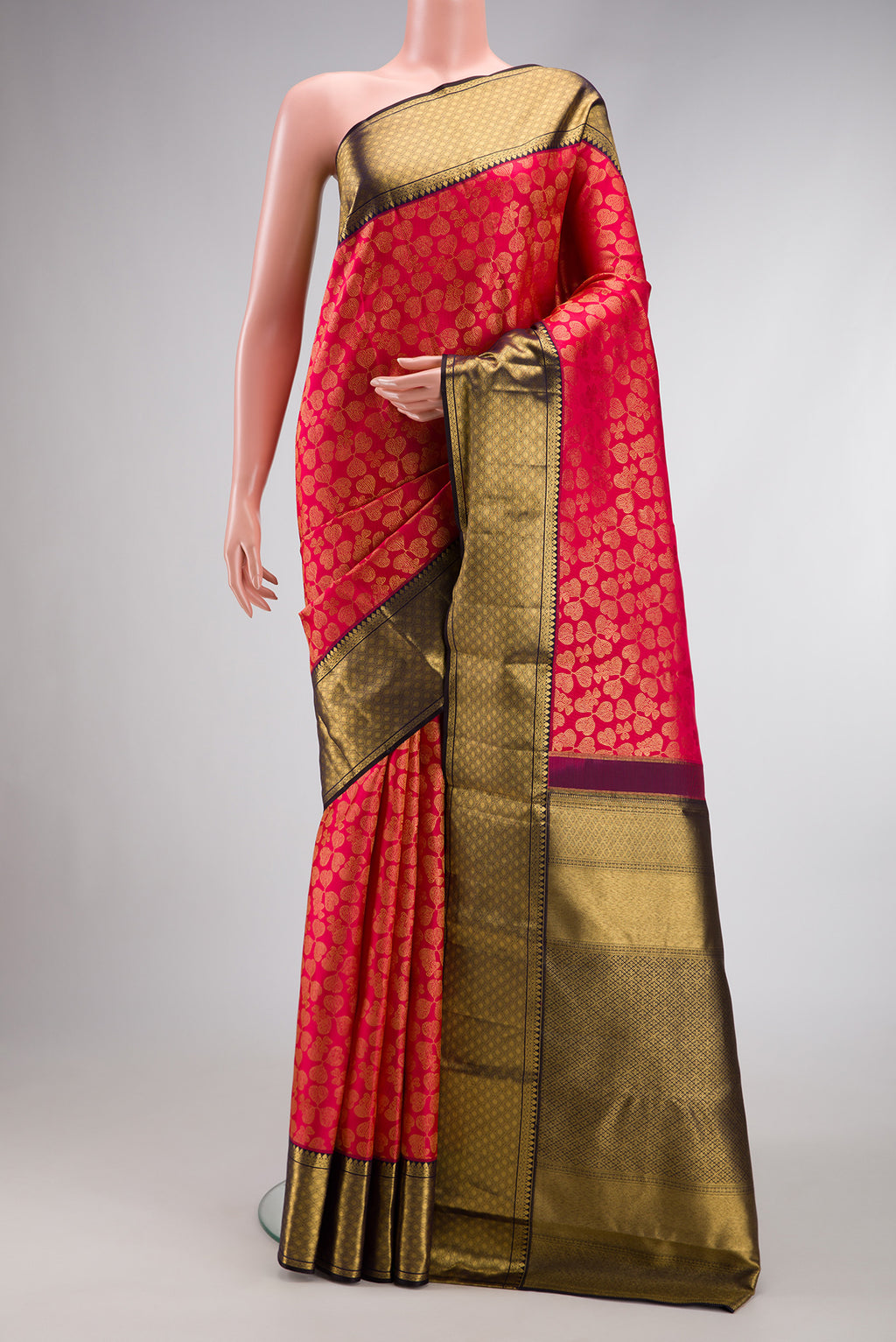Dark Pink Dual Tone Kanchipuram Silk Saree with Zari Brocade on the body and Zari Border.  displayed on a mannequin