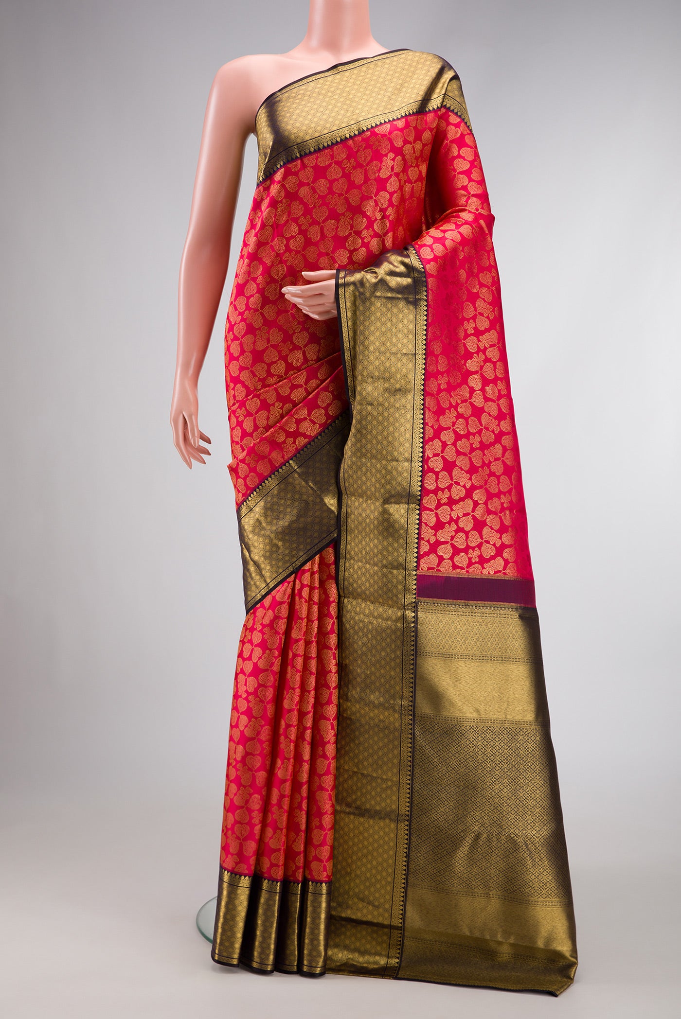 Dark Pink Dual Tone Kanchipuram Silk Saree with Zari Brocade on the body and Zari Border.  displayed on a mannequin