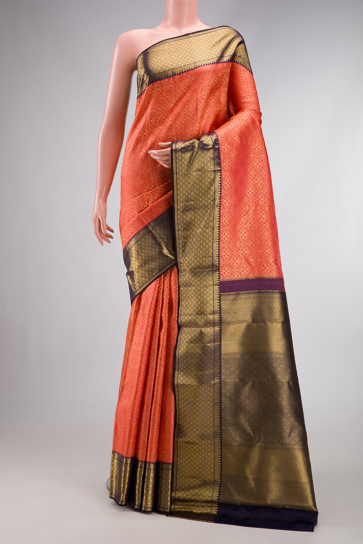 Coral Dual Tone Kanchipuram Silk Saree with Zari Brocade on the body and Zari Border.  displayed on a mannequin