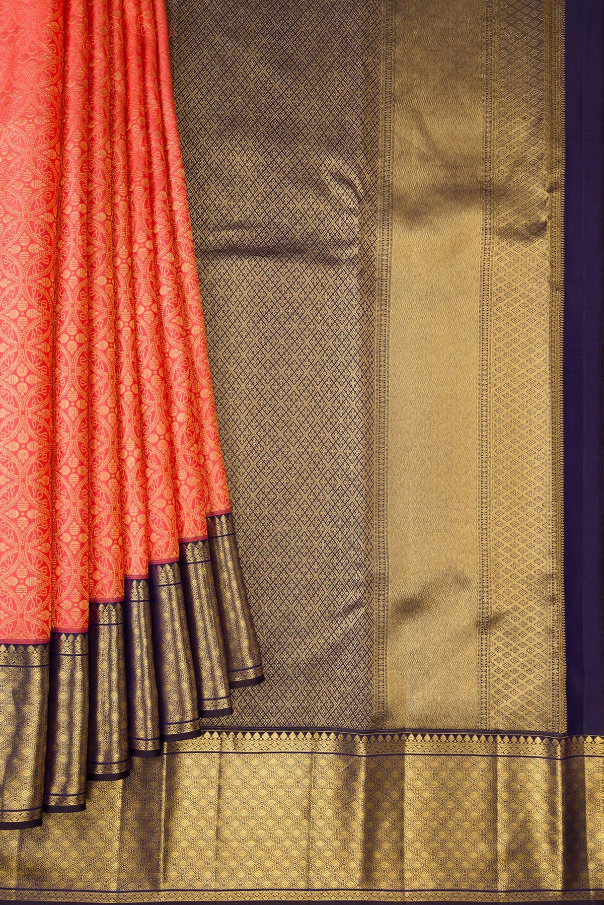 Pleats and pallu of Coral Dual Tone Kanchipuram Silk Saree with Zari Brocade on the body and Zari Border. 