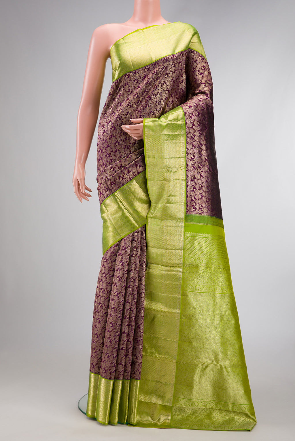 Magenta Dual Tone Kanchipuram Silk Saree with Zari Brocade on the body and Zari Border.  displayed on a mannequin