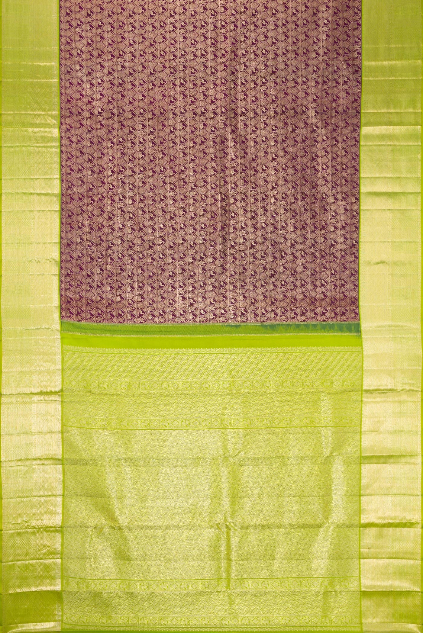 Flat view of Magenta Dual Tone Kanchipuram Silk Saree with Zari Brocade on the body and Zari Border. 