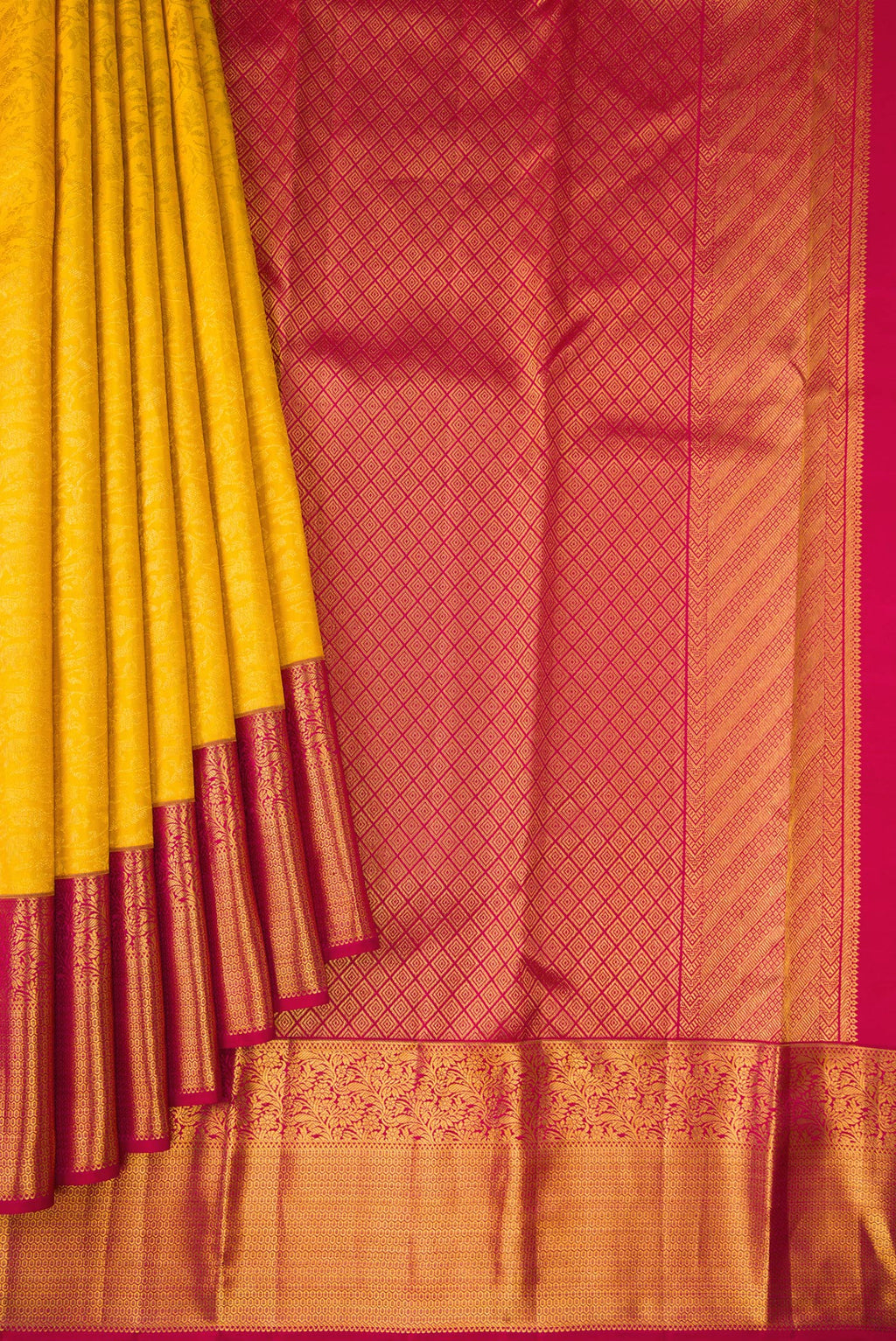 Pleats and pallu of Yellow Kanchipuram Silk Saree with Zari Brocade on the body and Zari Border. 