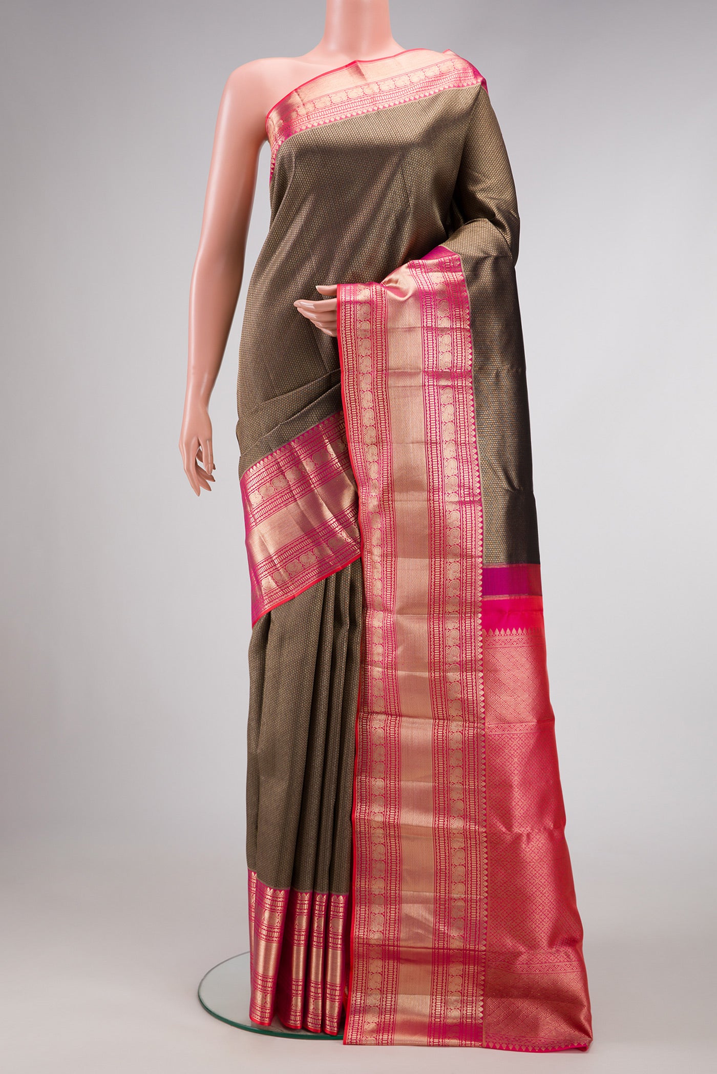 Coffee Brown Dual Tone Kanchipuram Silk Saree with Zari Brocade on the body and Zari Border.  displayed on a mannequin