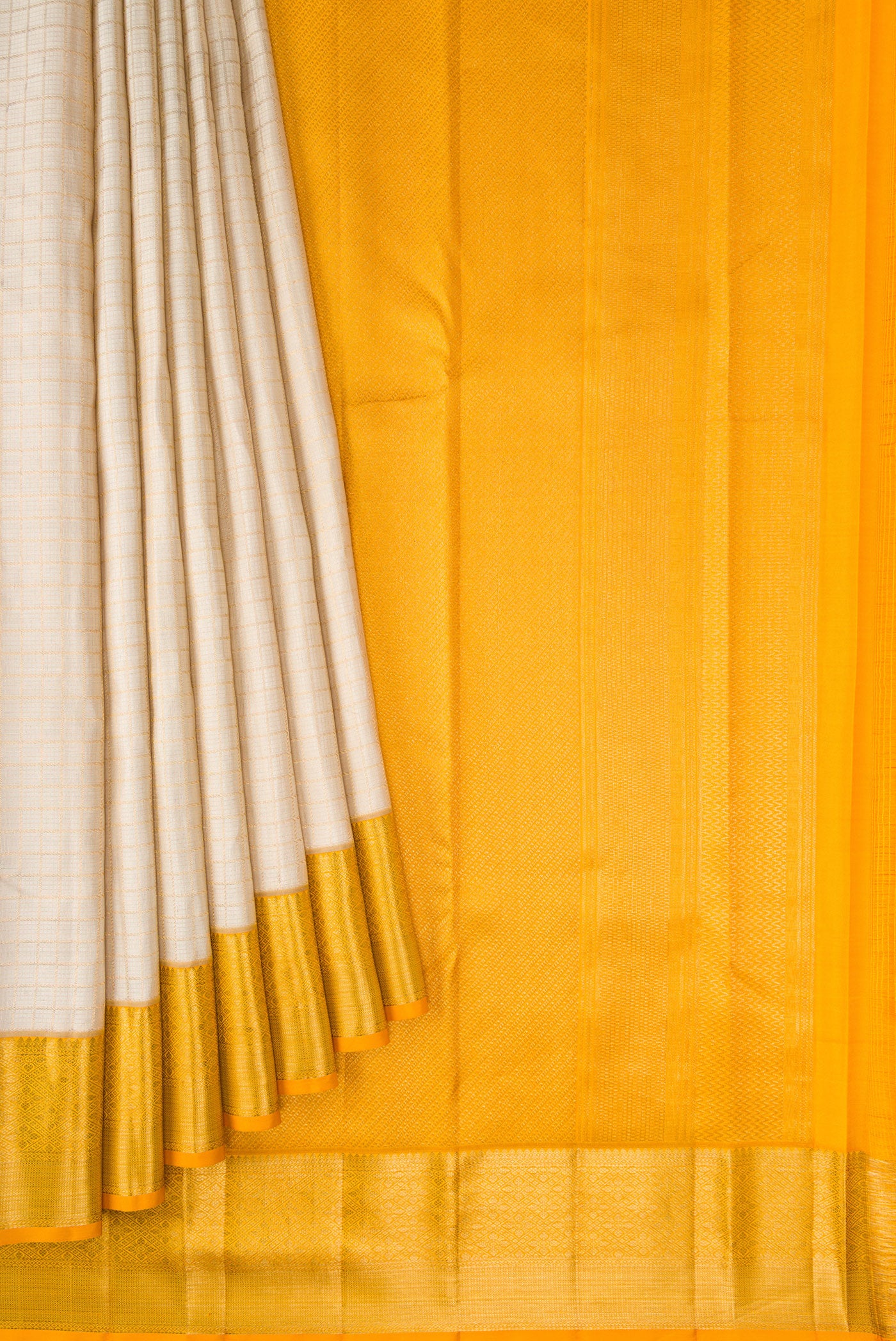 Pleats and pallu of Beige Dual Tone Kanchipuram Silk Saree with Checked design on the body and Zari Border. 