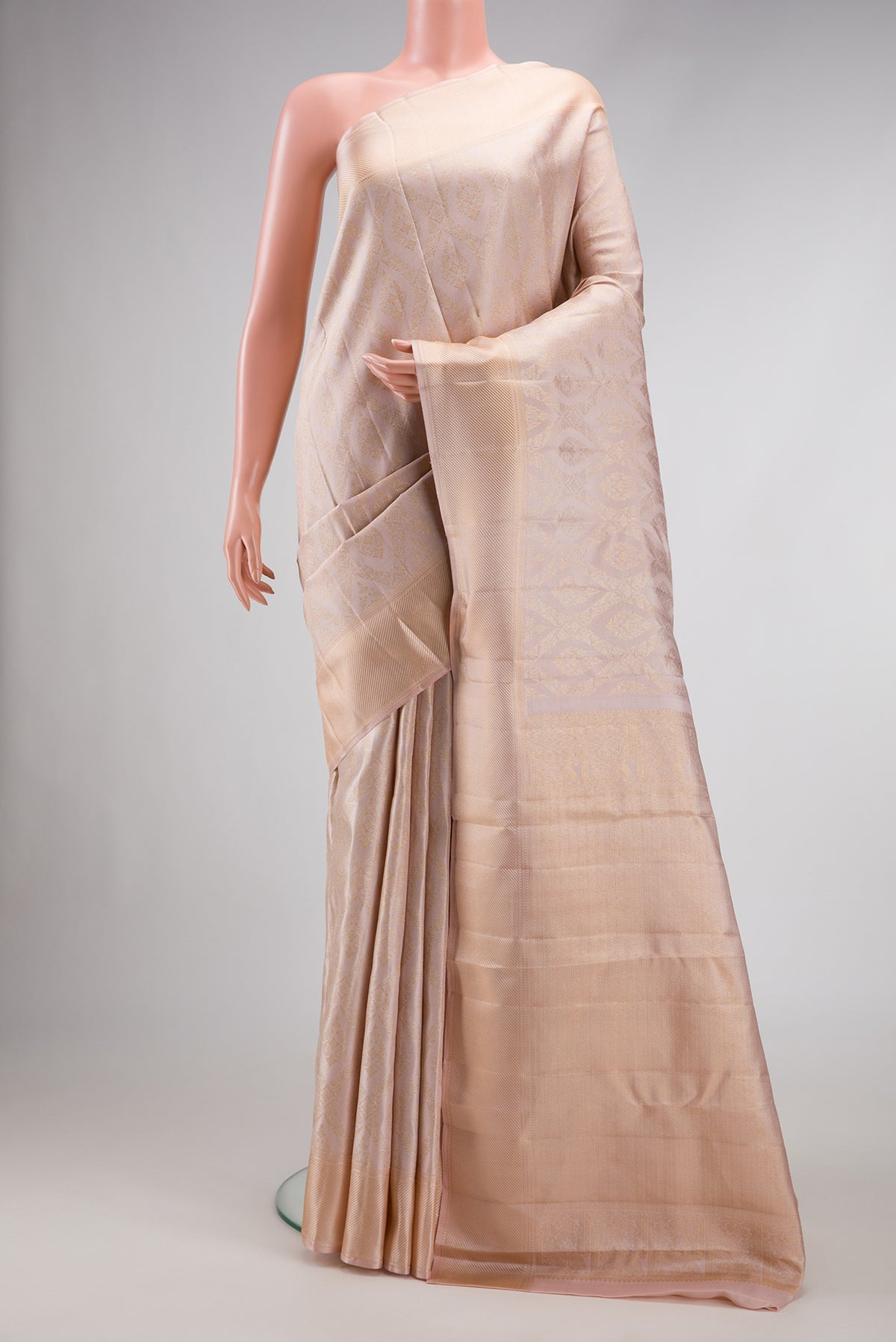 Rose Gold Dual Tone Kanchipuram Silk Saree with Zari Brocade on the body and Zari Border.  displayed on a mannequin