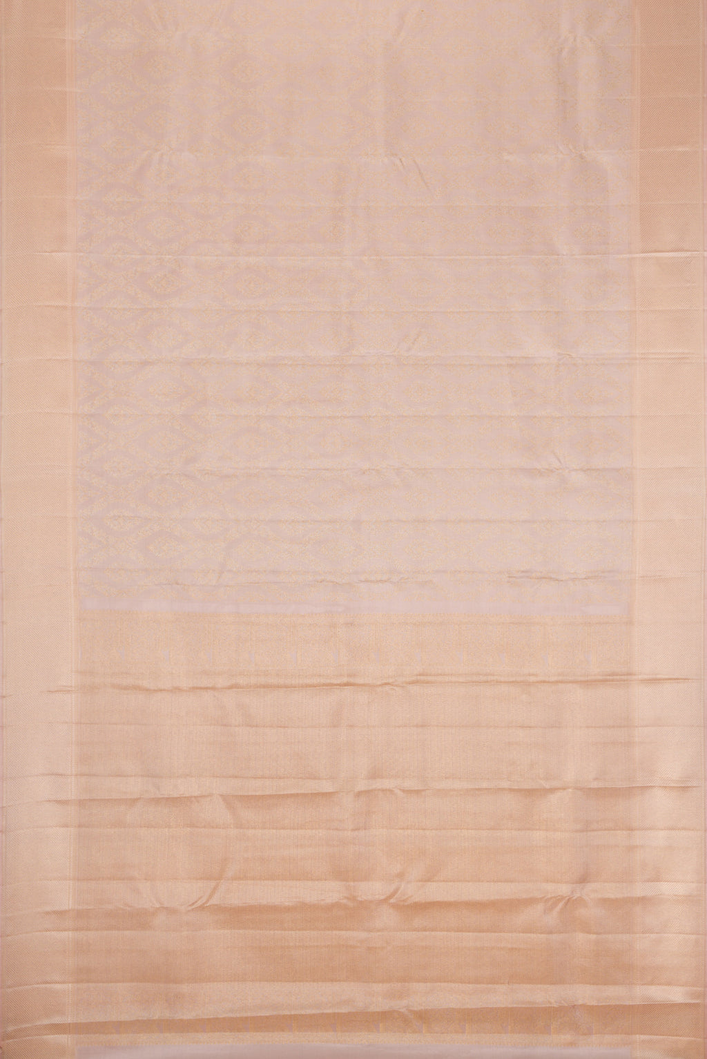 Flat view of Rose Gold Dual Tone Kanchipuram Silk Saree with Zari Brocade on the body and Zari Border. 