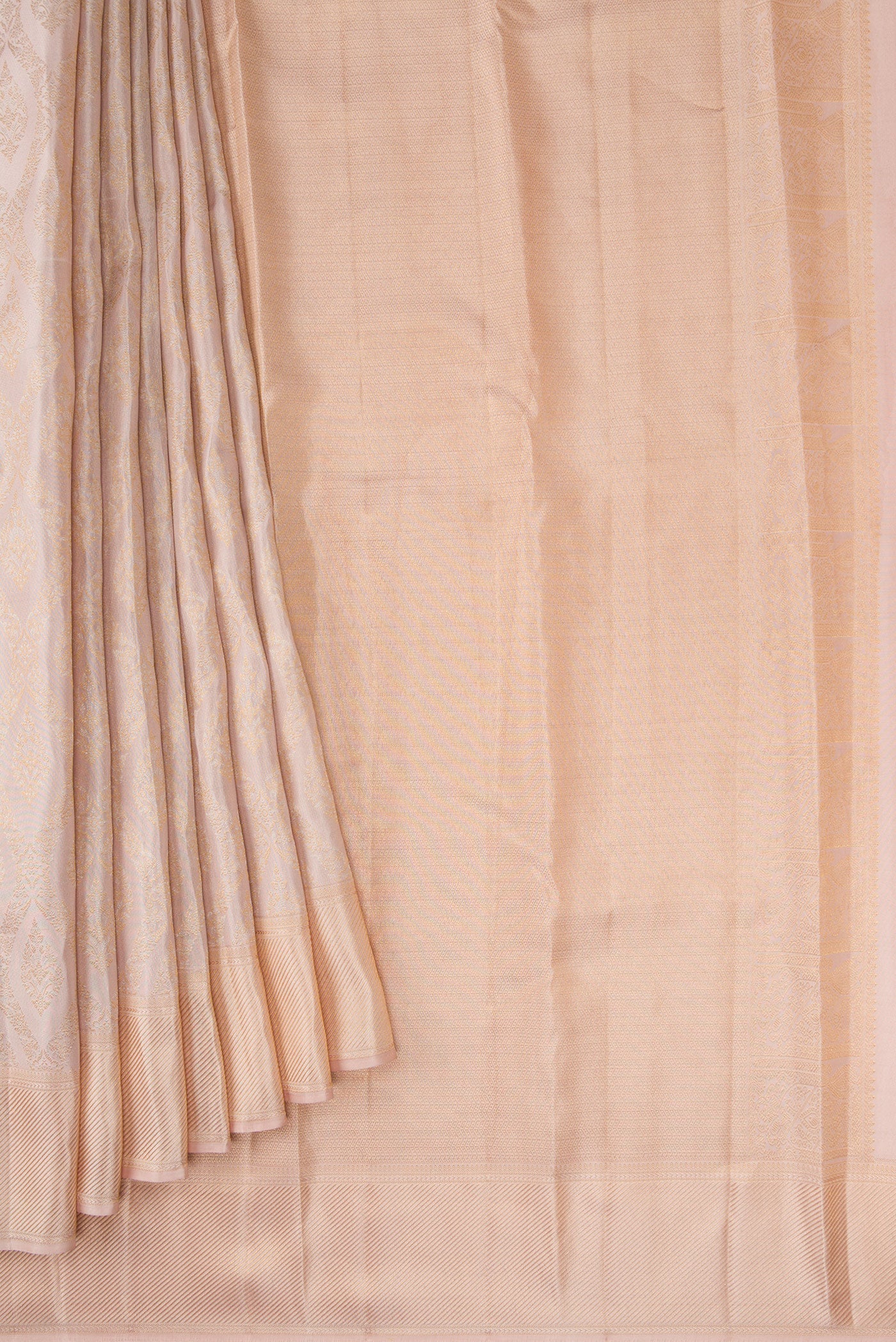 Pleats and pallu of Rose Gold Dual Tone Kanchipuram Silk Saree with Zari Brocade on the body and Zari Border. 