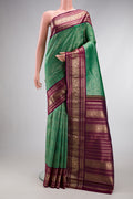 Sea Green Dual Tone Kanchipuram Silk Saree with Zari Brocade on the body and Zari Border.  displayed on a mannequin
