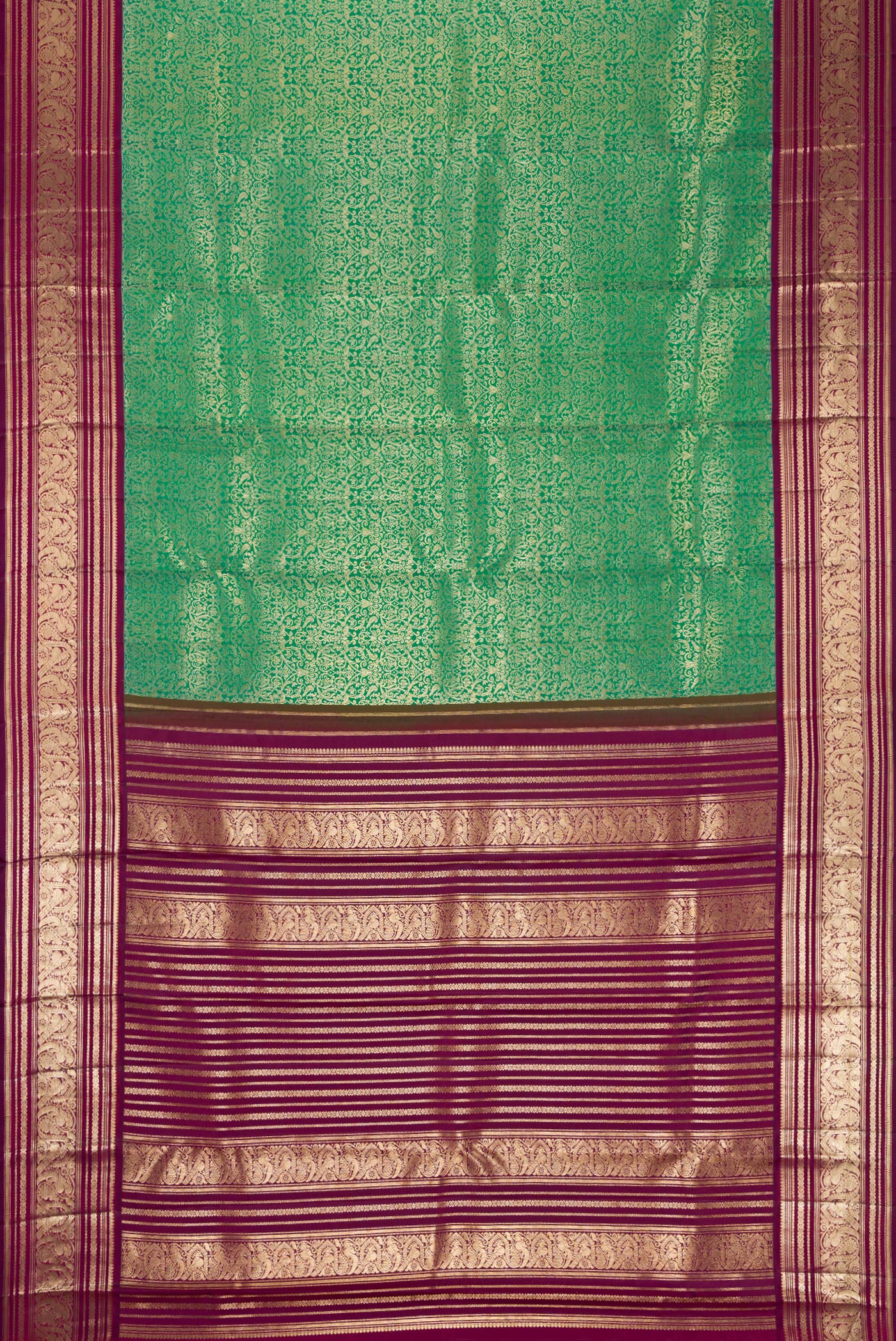 Flat view of Sea Green Dual Tone Kanchipuram Silk Saree with Zari Brocade on the body and Zari Border. 