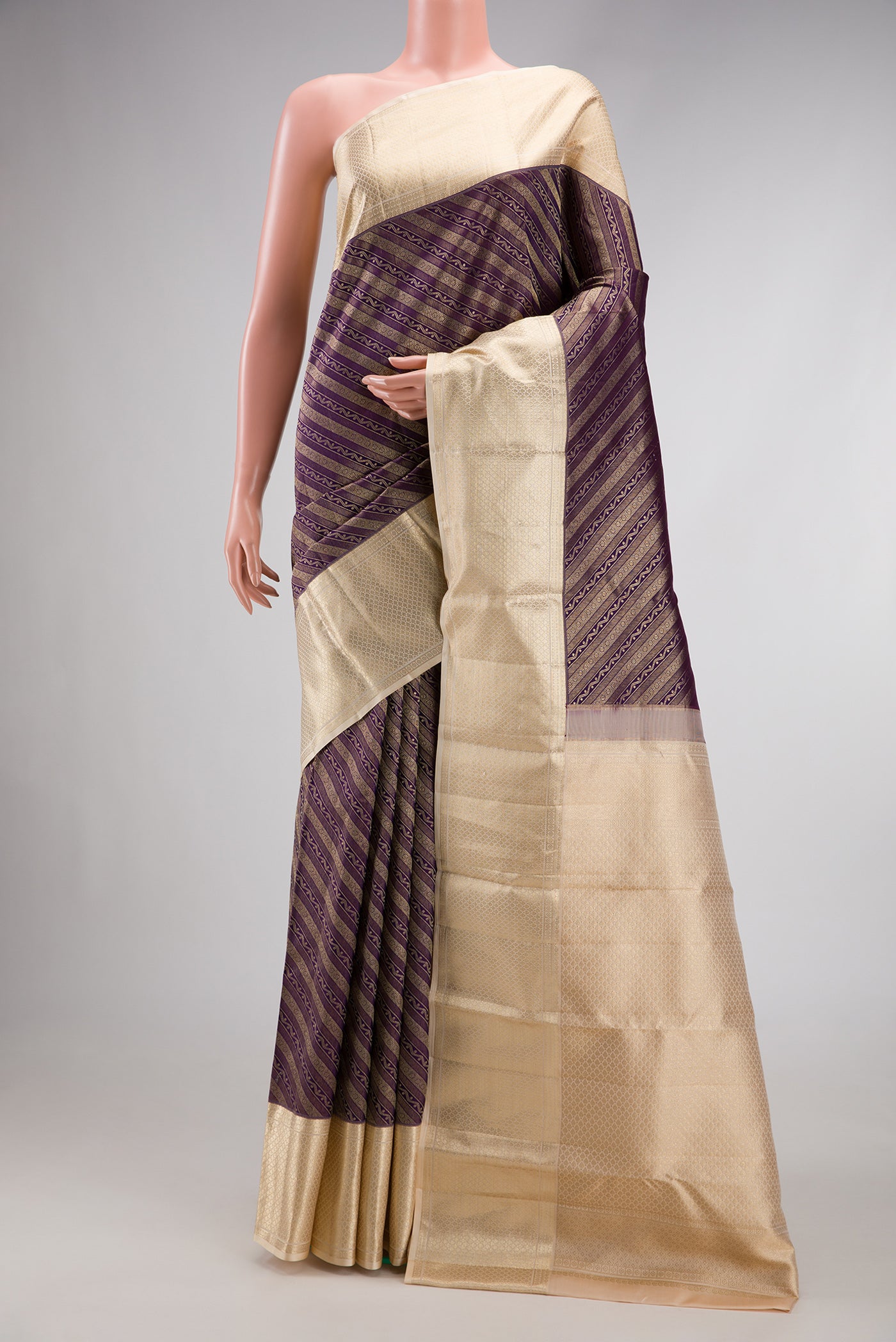 Purple Dual Tone Kanchipuram Silk Saree with Zari Brocade on the body and Zari Border.  displayed on a mannequin
