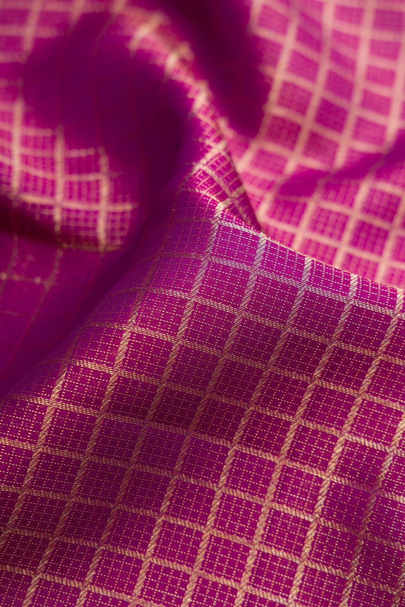 Close up of Purple Dual Tone Kanchipuram Silk Saree with Zari Brocade on the body and Zari Border.  displaying folds