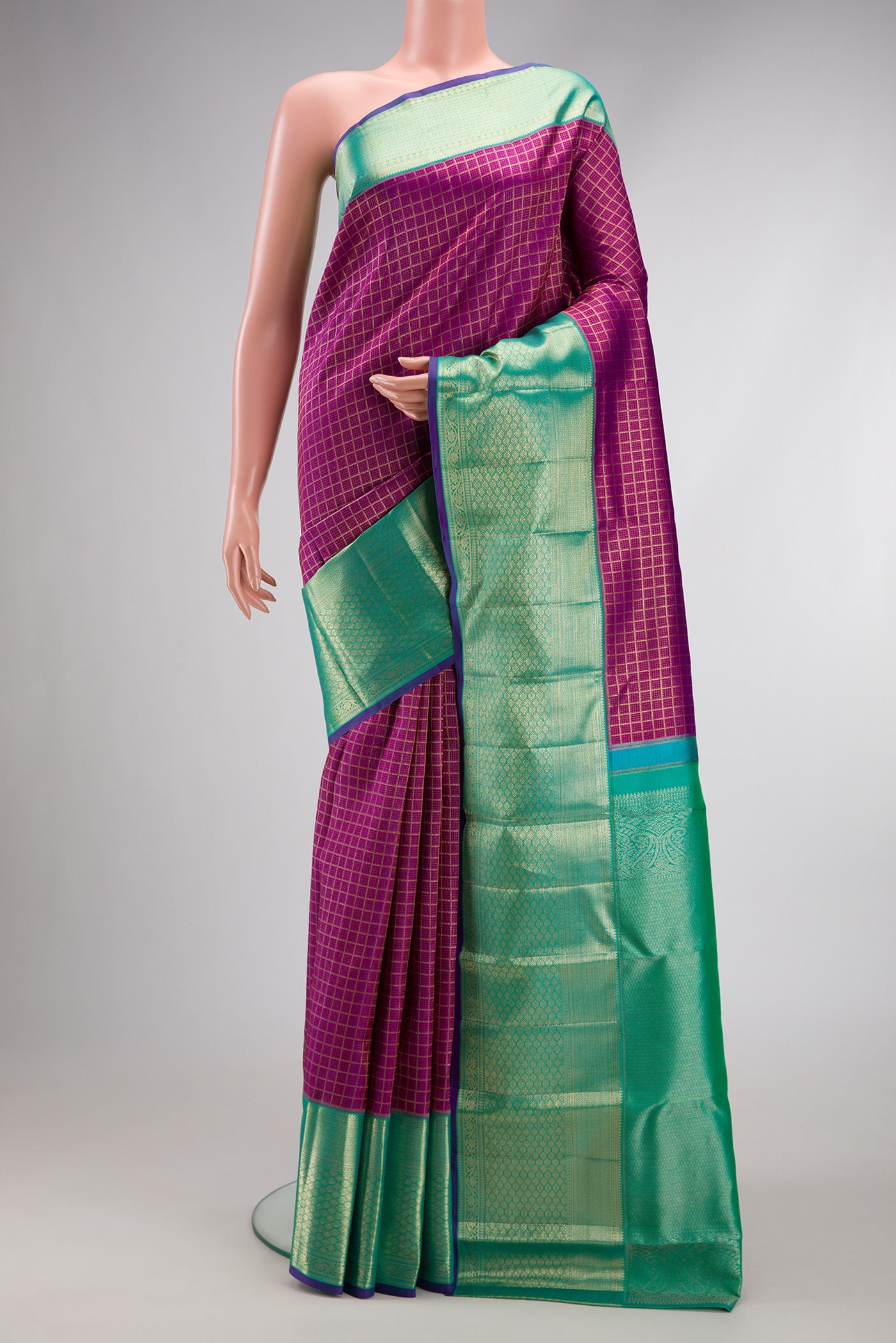 Purple Dual Tone Kanchipuram Silk Saree with Zari Brocade on the body and Zari Border.  displayed on a mannequin