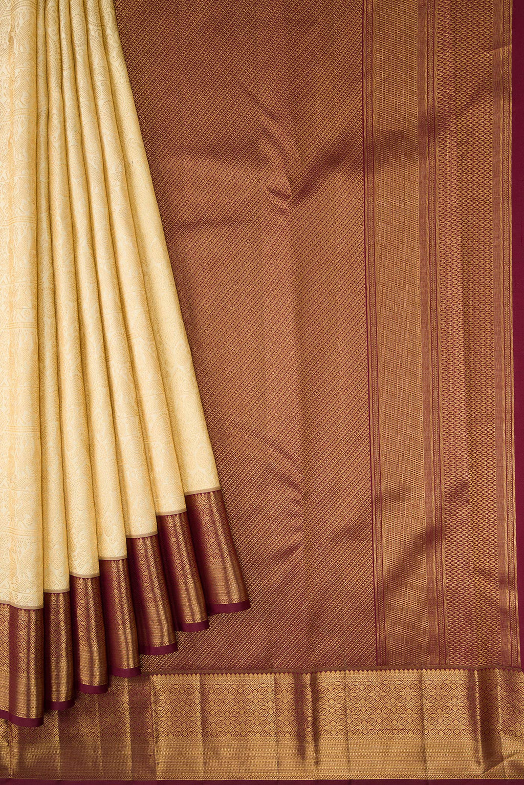 Pleats and pallu of Gold Dual Tone Kanchipuram Silk Saree with Zari Brocade on the body and Zari Border. 