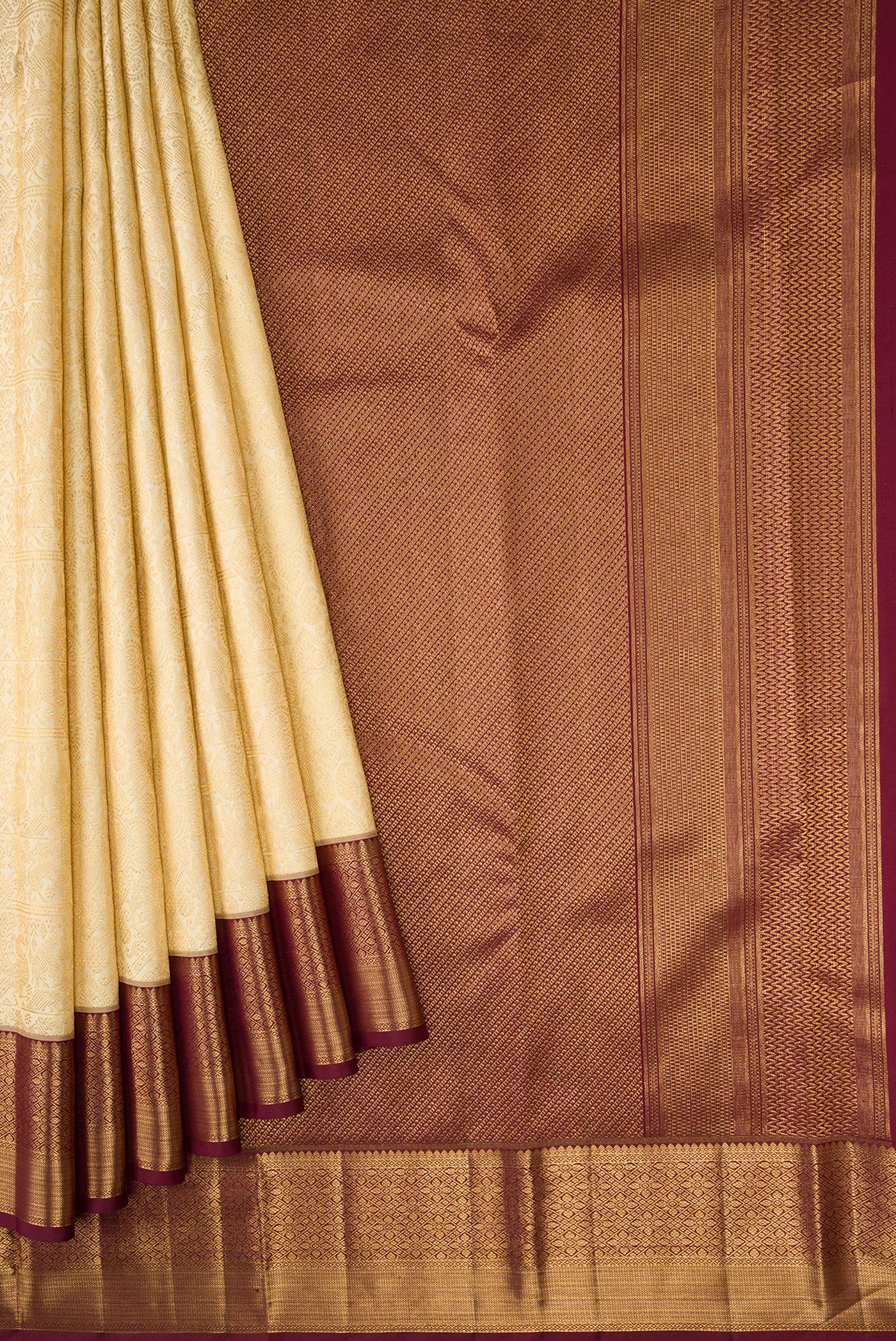 Pleats and pallu of Gold Dual Tone Kanchipuram Silk Saree with Zari Brocade on the body and Zari Border. 