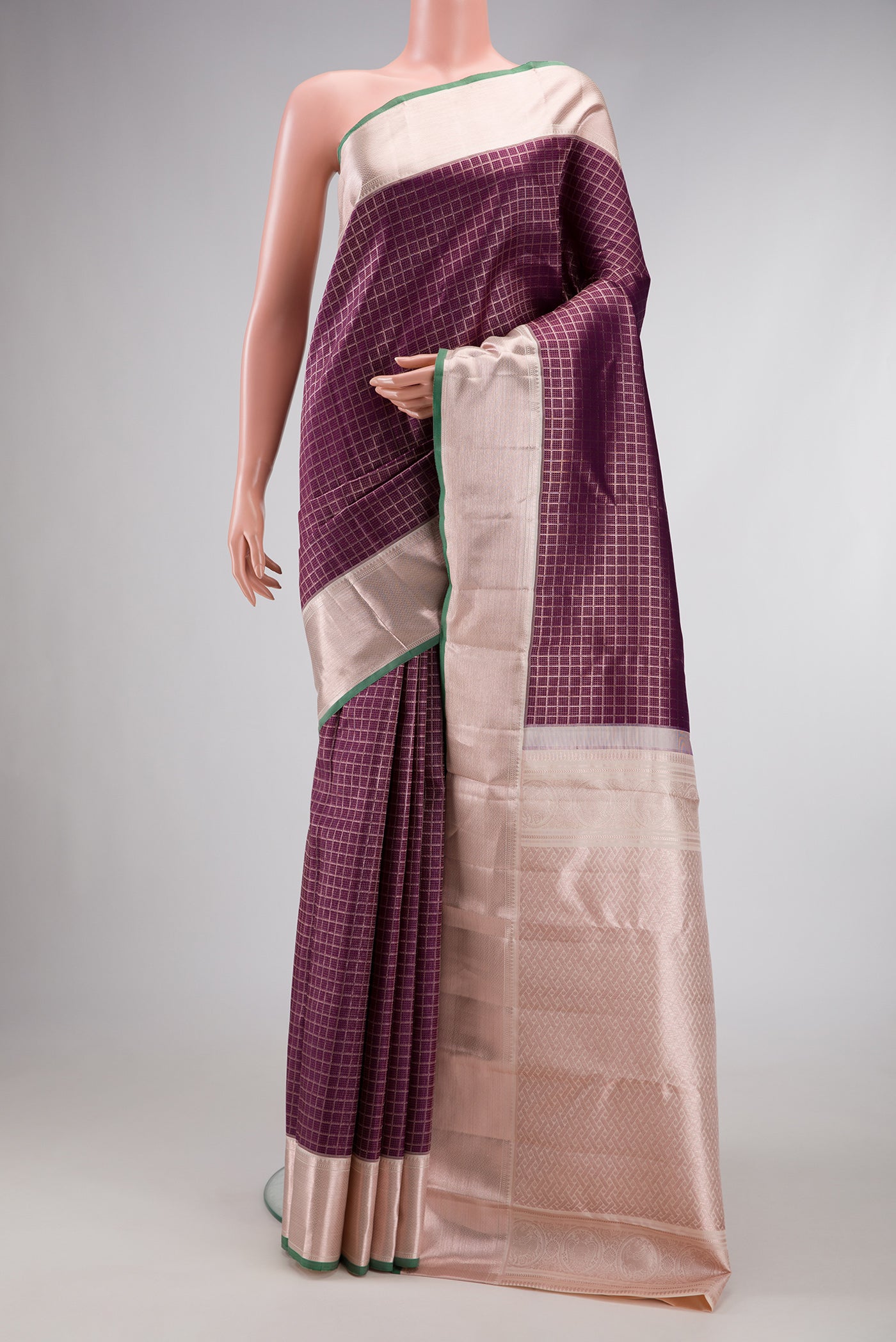 Burgundy Dual Tone Kanchipuram Silk Saree with Zari Brocade on the body and Zari Border.  displayed on a mannequin