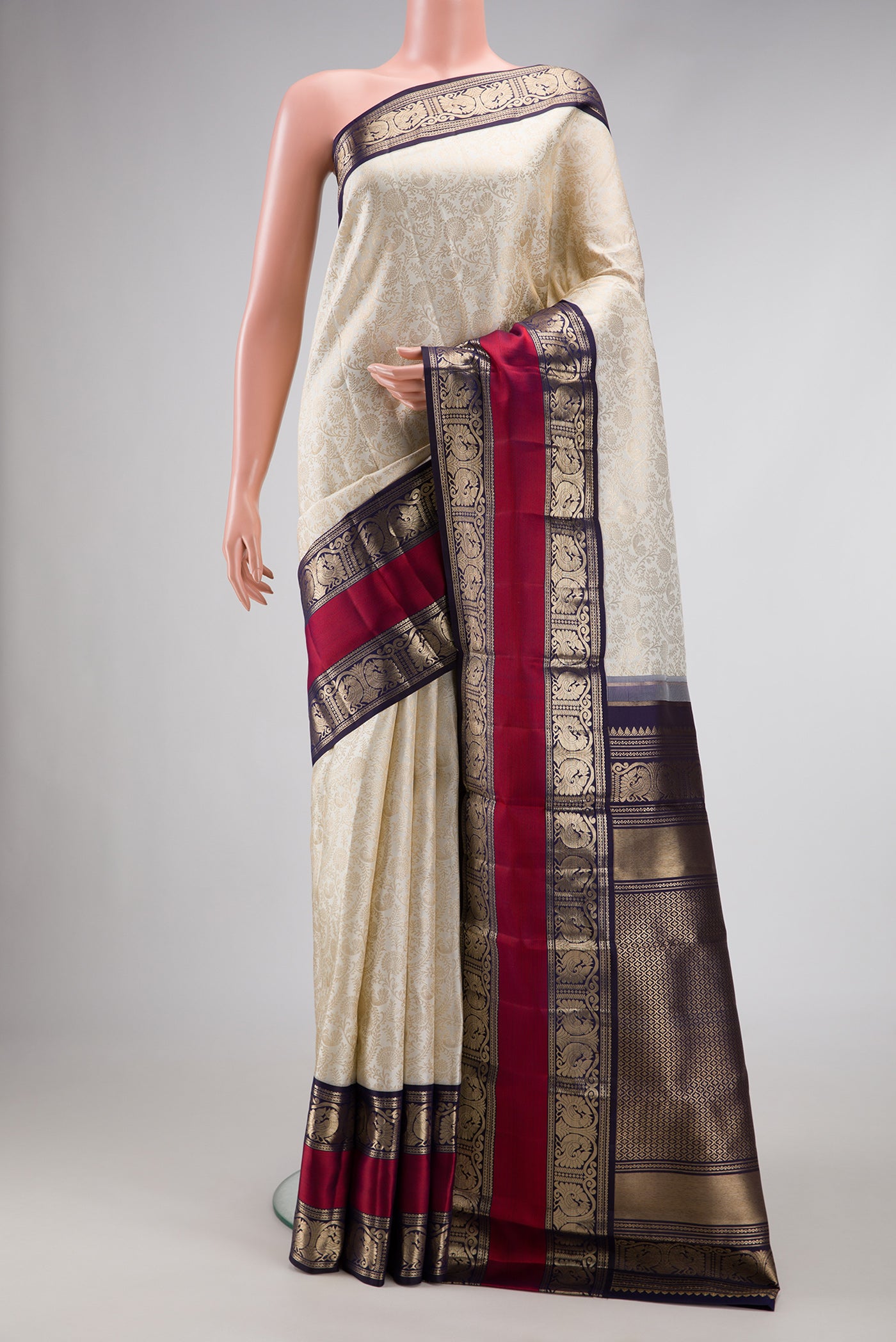 Off White Dual Tone Kanchipuram Silk Saree with Zari Brocade on the body and Zari Border.  displayed on a mannequin