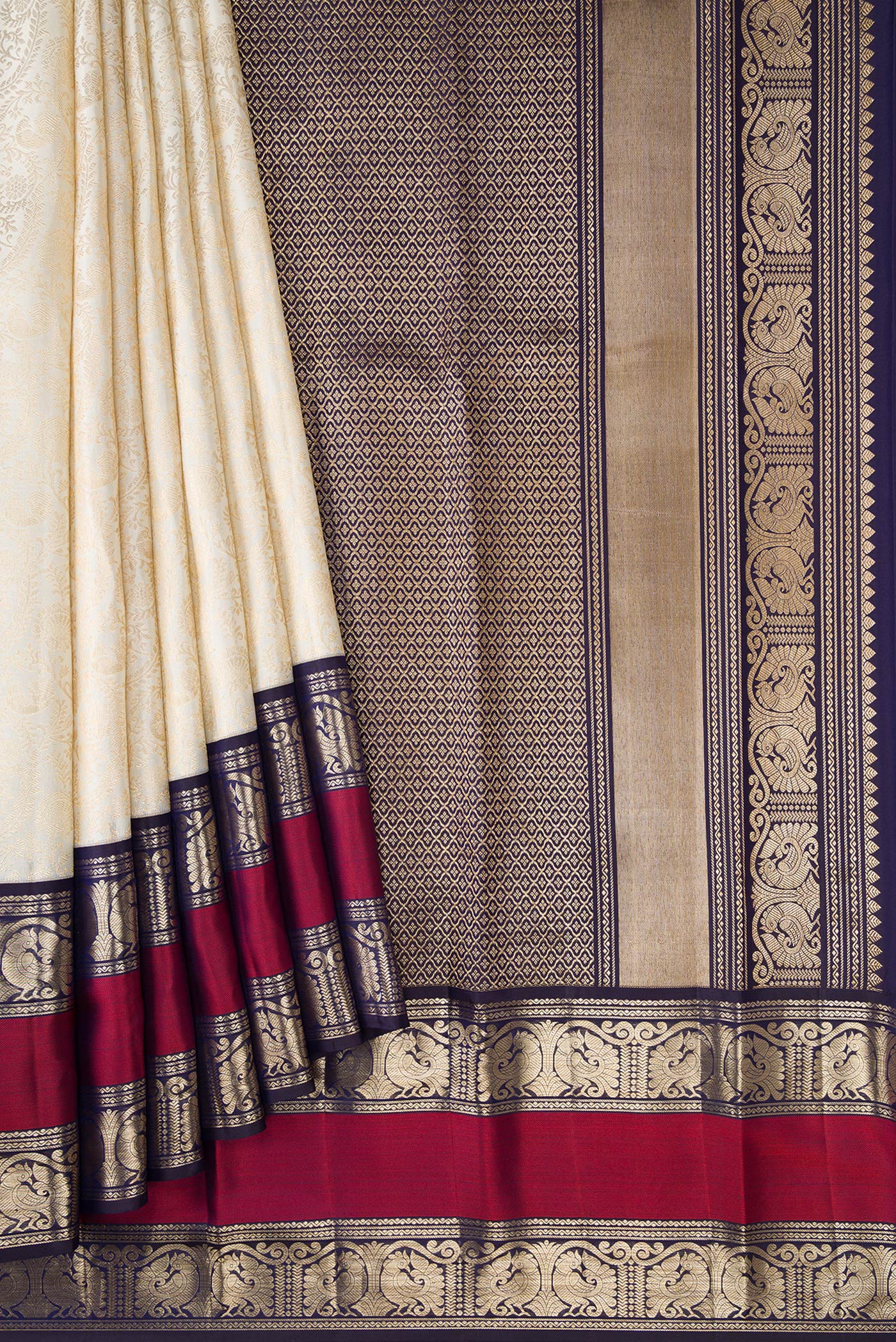 Pleats and pallu of Off White Dual Tone Kanchipuram Silk Saree with Zari Brocade on the body and Zari Border. 