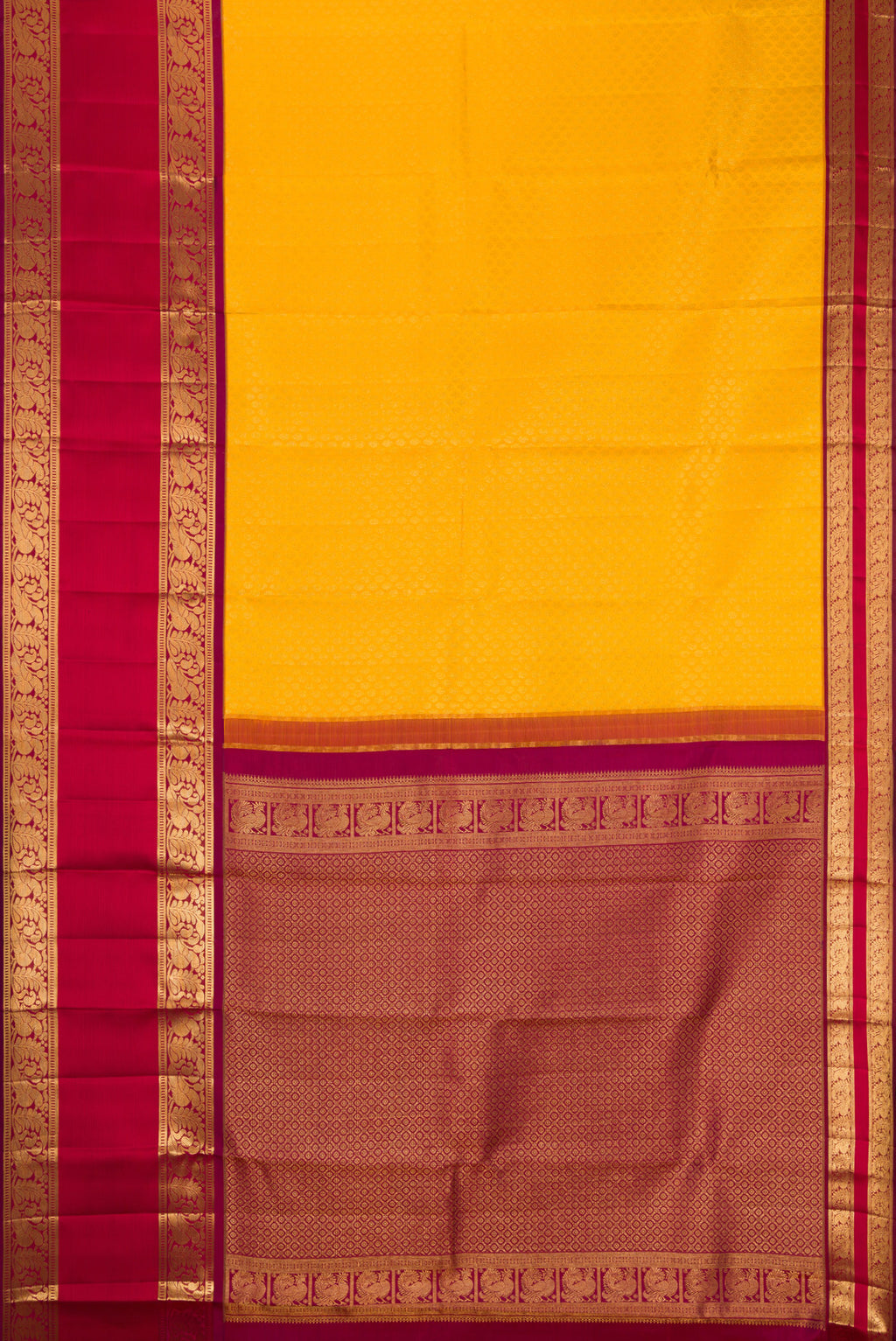 Flat view of Yellow Kanchipuram Silk Saree with Zari Brocade on the body and Zari Border. 