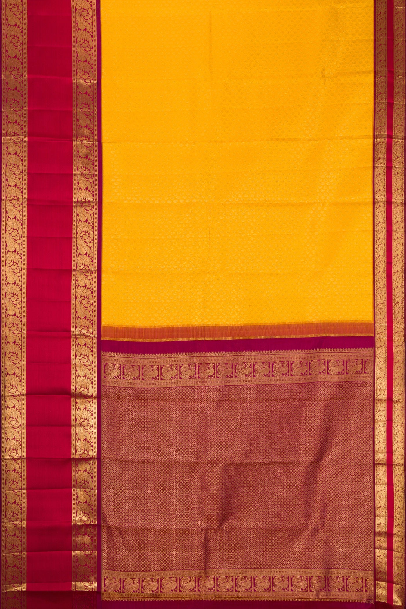 Flat view of Yellow Kanchipuram Silk Saree with Zari Brocade on the body and Zari Border. 