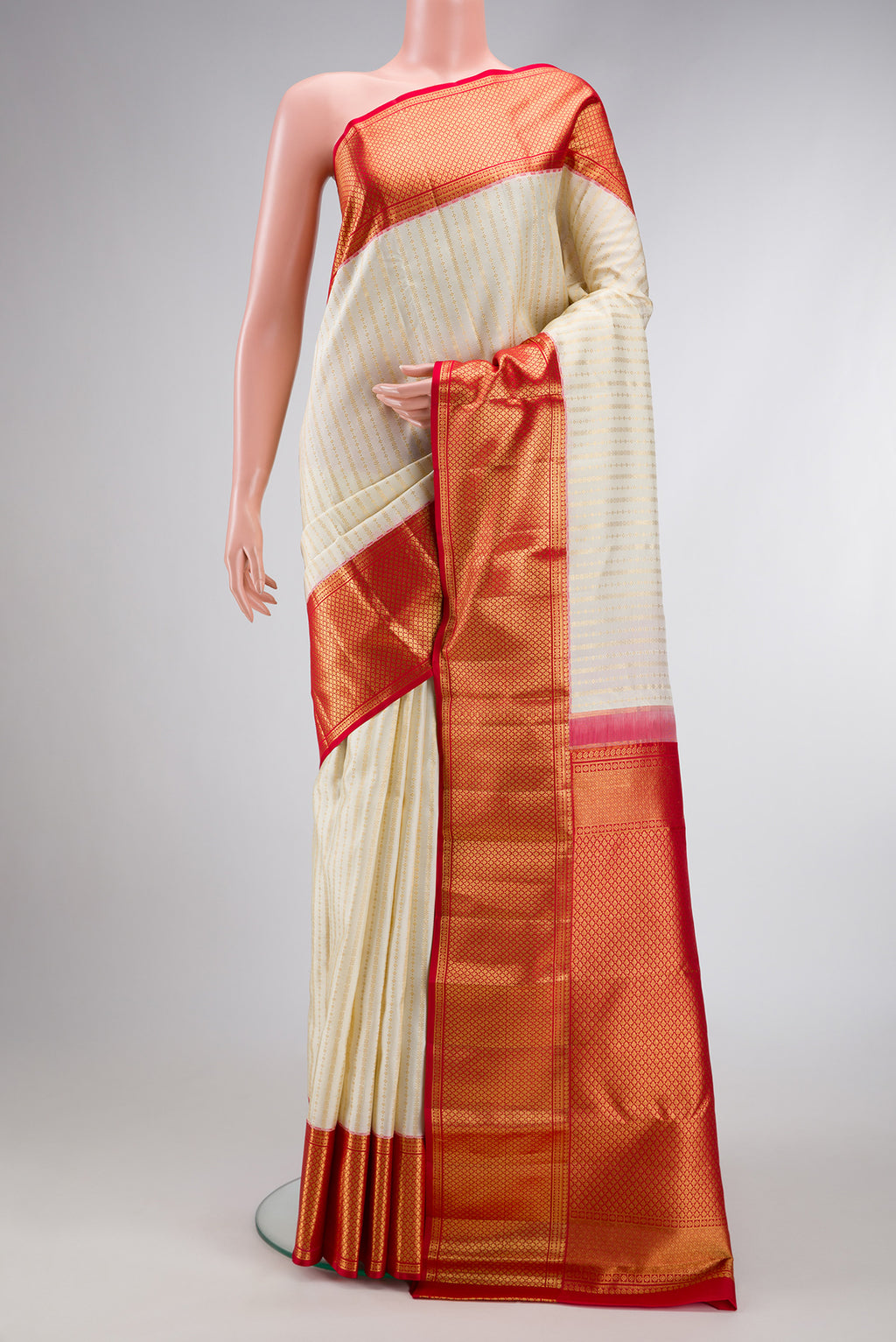 Off White Dual Tone Kanchipuram Silk Saree with Zari Brocade on the body and Zari Border.  displayed on a mannequin