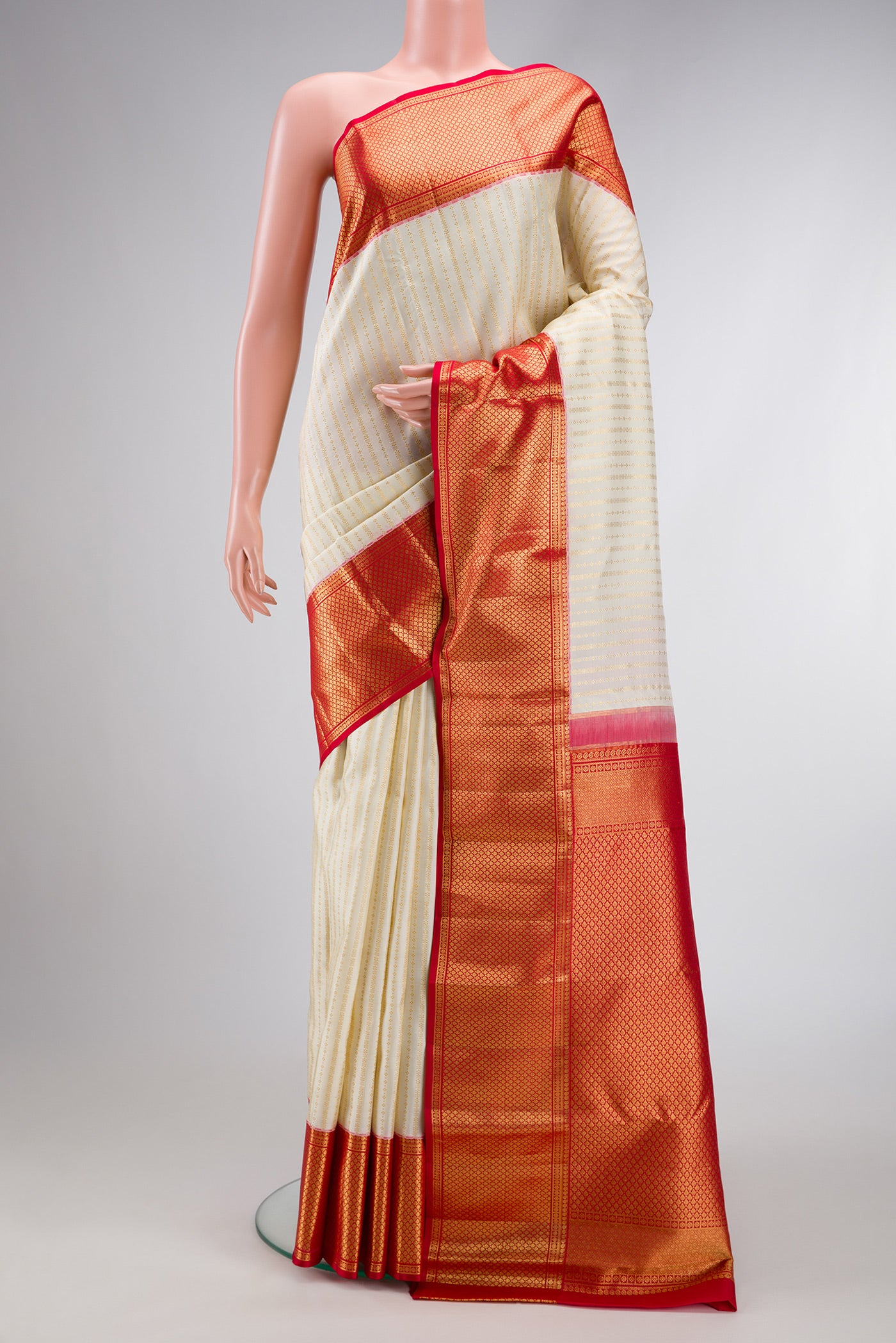 Off White Dual Tone Kanchipuram Silk Saree with Zari Brocade on the body and Zari Border.  displayed on a mannequin