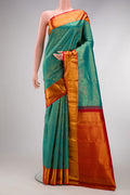 Peacock Blue Dual Tone Kanchipuram Silk Saree with Zari Brocade on the body and Zari Border.  displayed on a mannequin