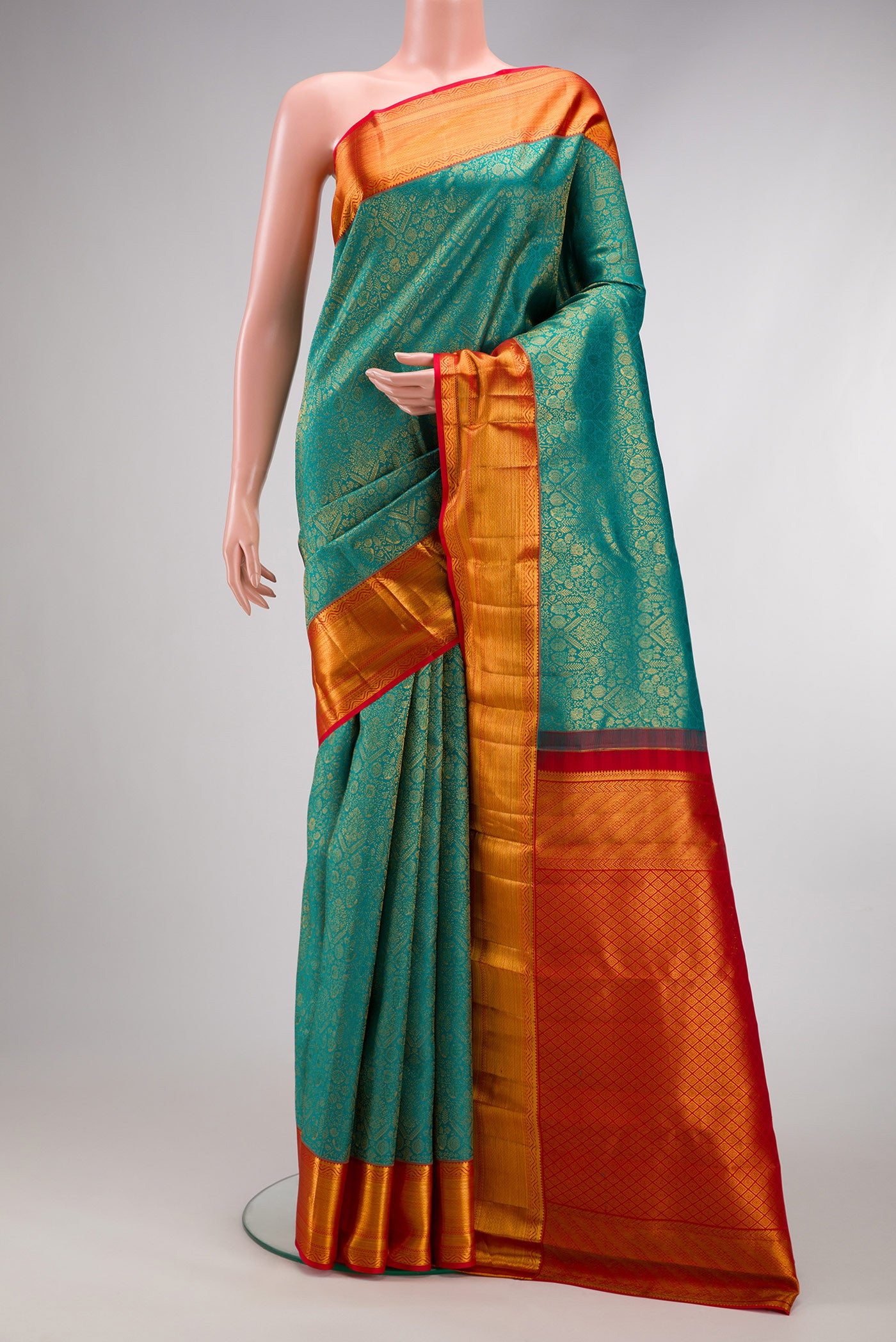 Peacock Blue Dual Tone Kanchipuram Silk Saree with Zari Brocade on the body and Zari Border.  displayed on a mannequin