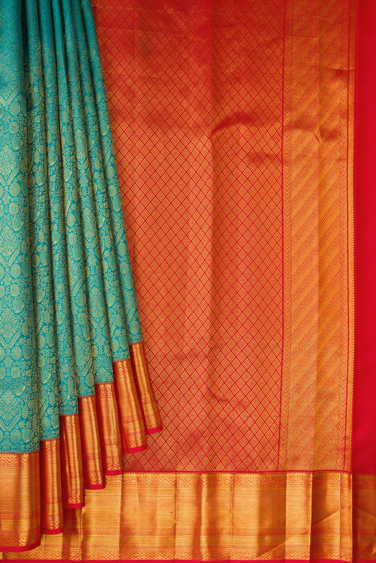 Pleats and pallu of Peacock Blue Dual Tone Kanchipuram Silk Saree with Zari Brocade on the body and Zari Border. 