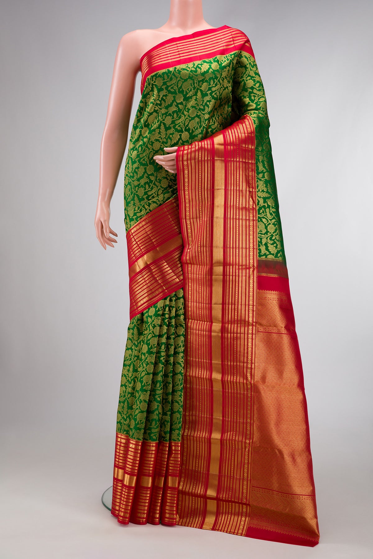 Bottle Green Dual Tone Kanchipuram Silk Saree with Zari Brocade on the body and Zari Border.  displayed on a mannequin