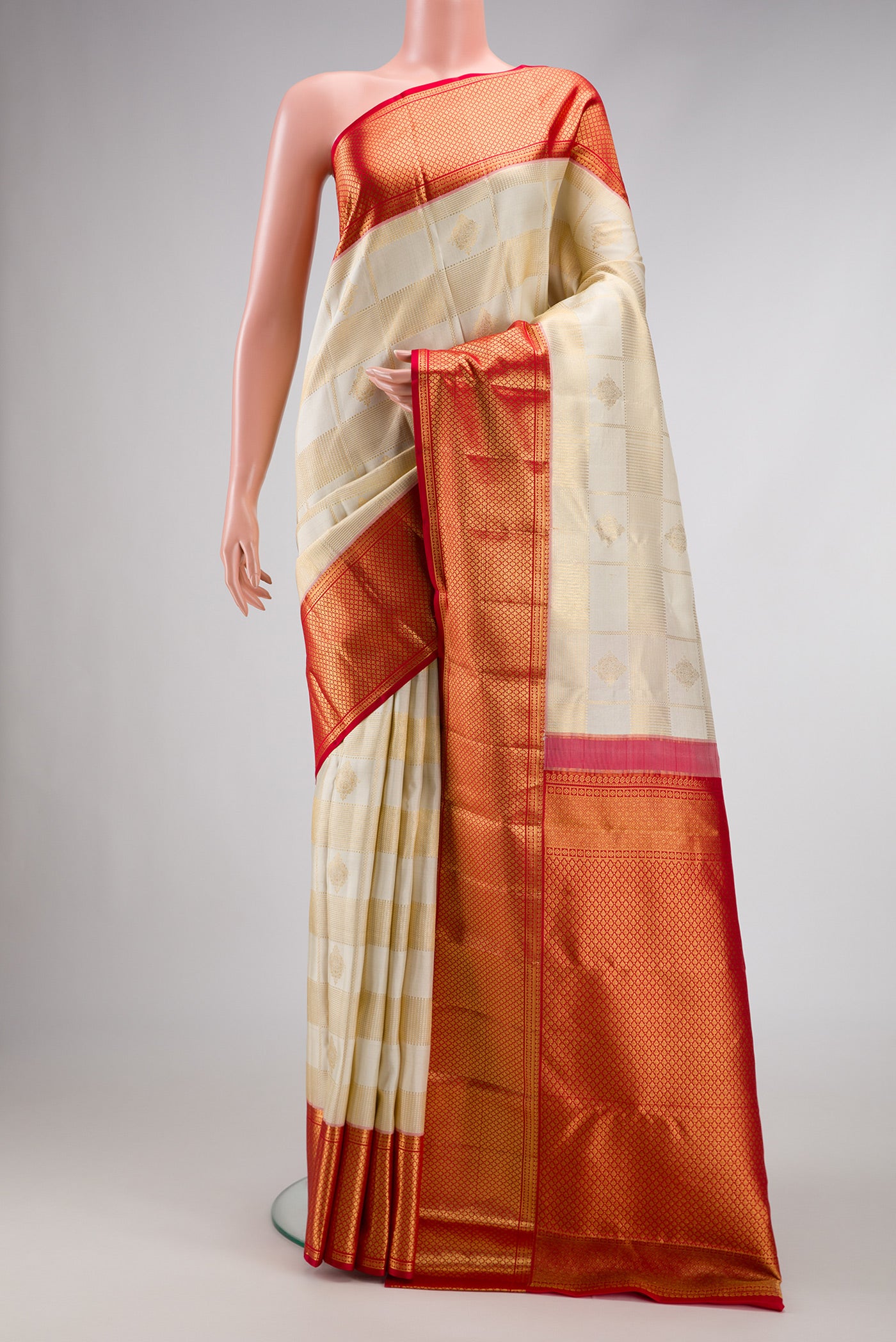 Off White Dual Tone Kanchipuram Silk Saree with Zari Brocade on the body and Zari Border.  displayed on a mannequin