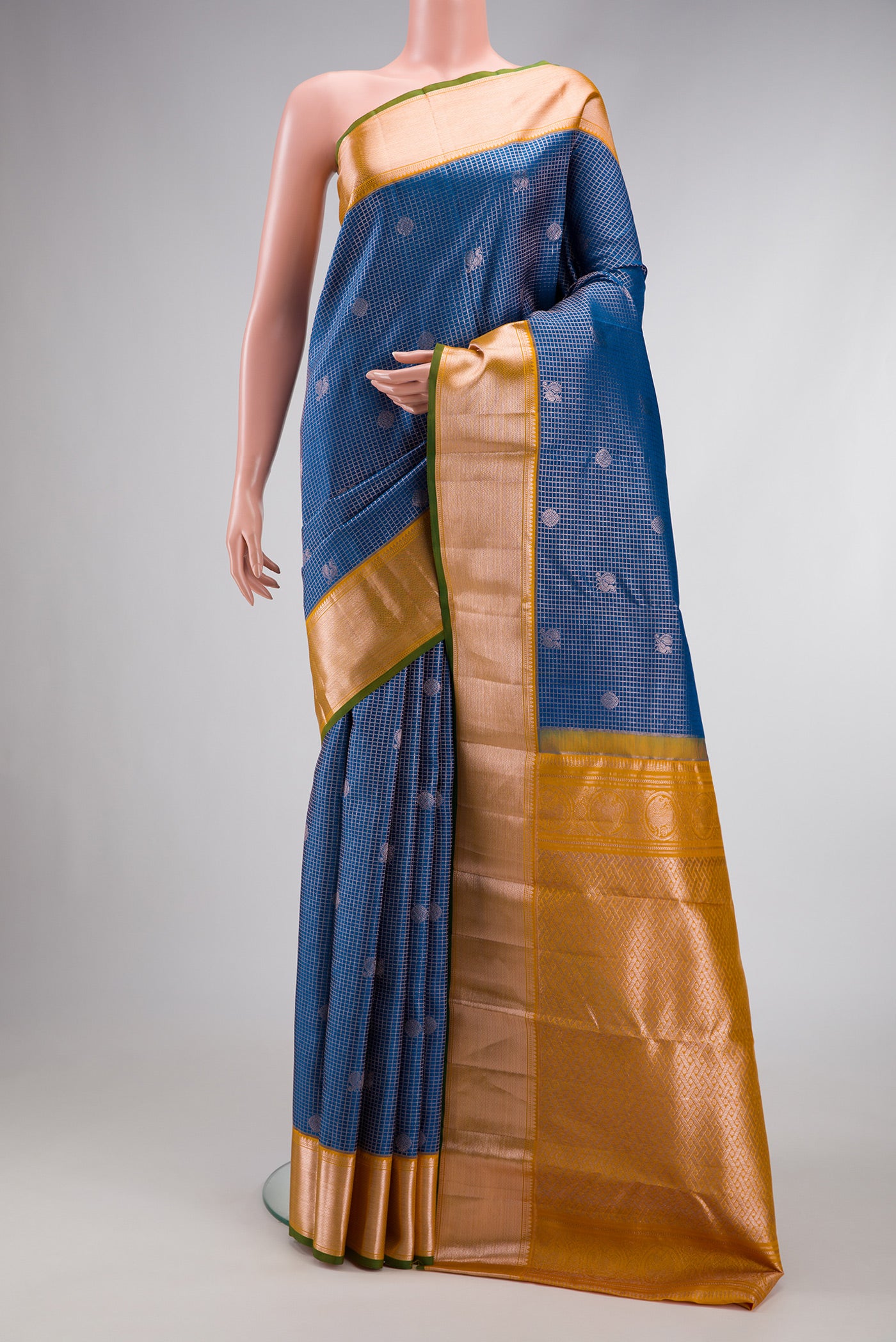 Peacock Blue Dual Tone Kanchipuram Silk Saree with Zari Brocade on the body and Zari Border.  displayed on a mannequin