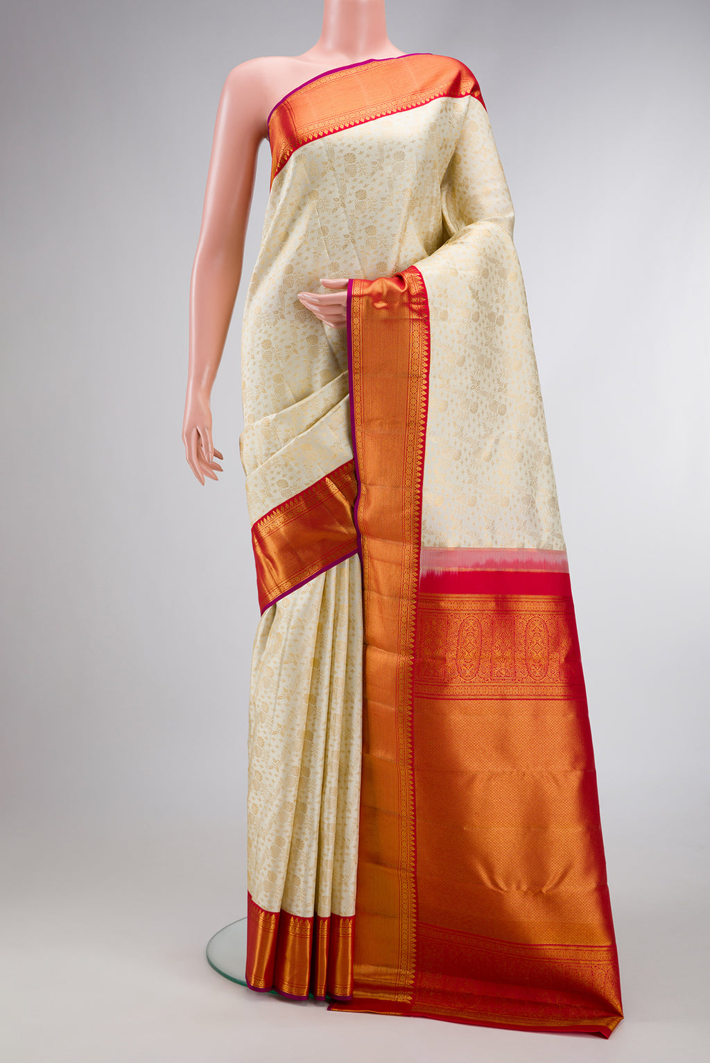 Off White Dual Tone Kanjivaram Silk Saree with Zari Brocade on the body and Zari Border.  displayed on a mannequin